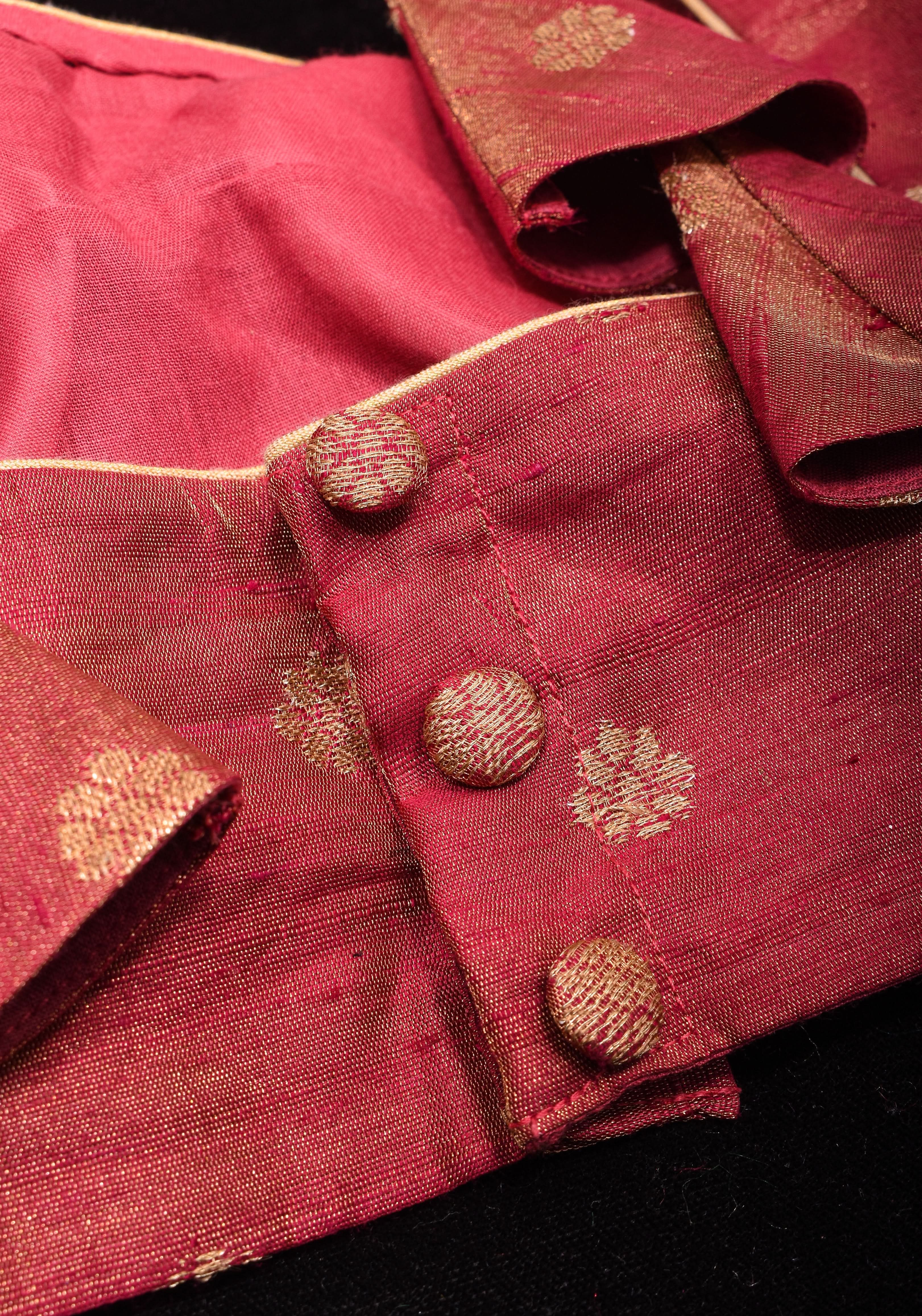 Deep Square Neck Sleeveless blouse in Reddish pink Pure Tissue Raw silk with zari buttas | Shobitam