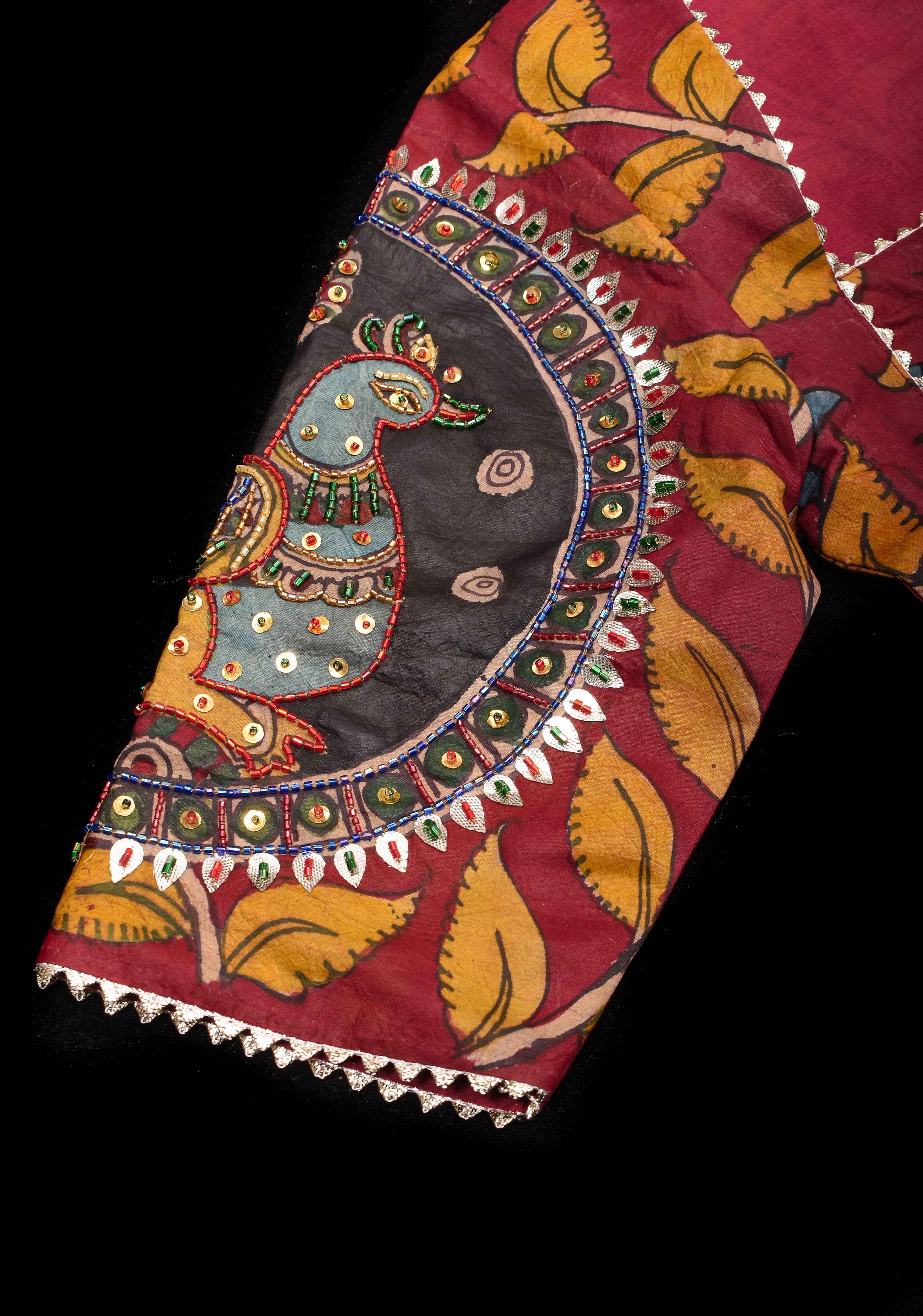 Red Kalamkari blouse with peacock designs, and cutdana, gotta and sequins handwork | Shobitam