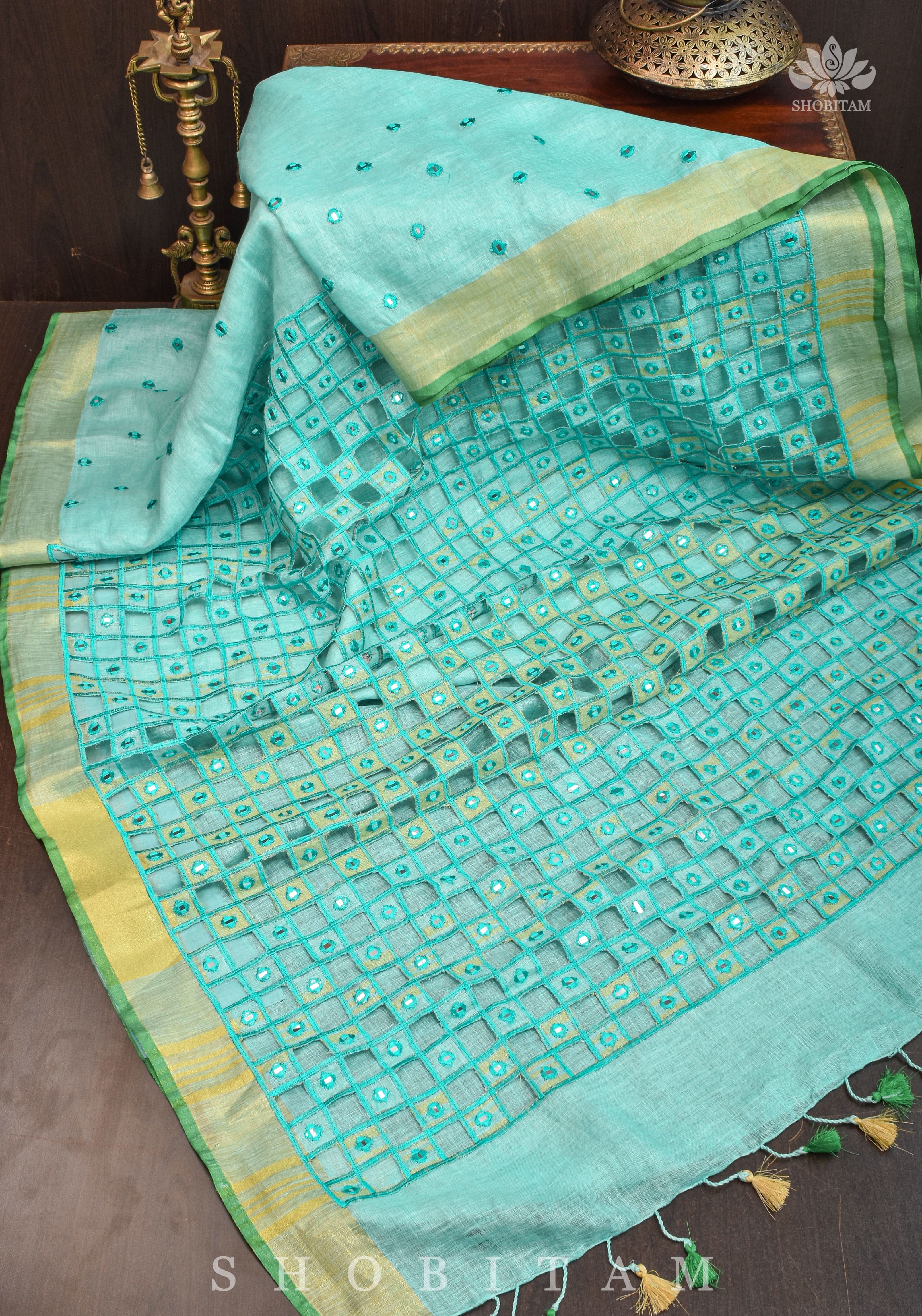 Jaali Pallu - Cutwork and Mirrorwork Saree in Linen by Linen in Teal Color | Shobitam