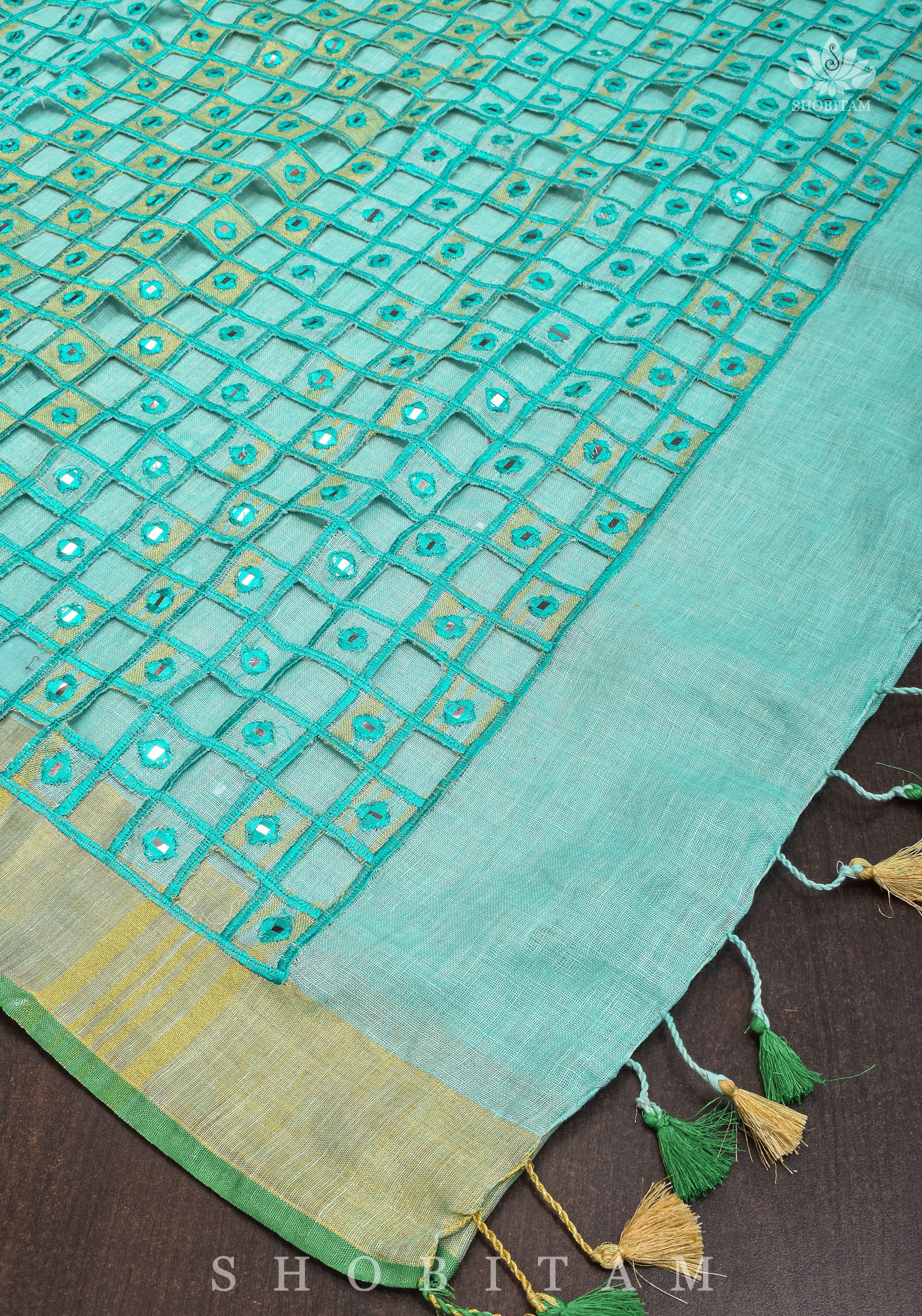 Jaali Pallu - Cutwork and Mirrorwork Saree in Linen by Linen in Teal Color | Shobitam