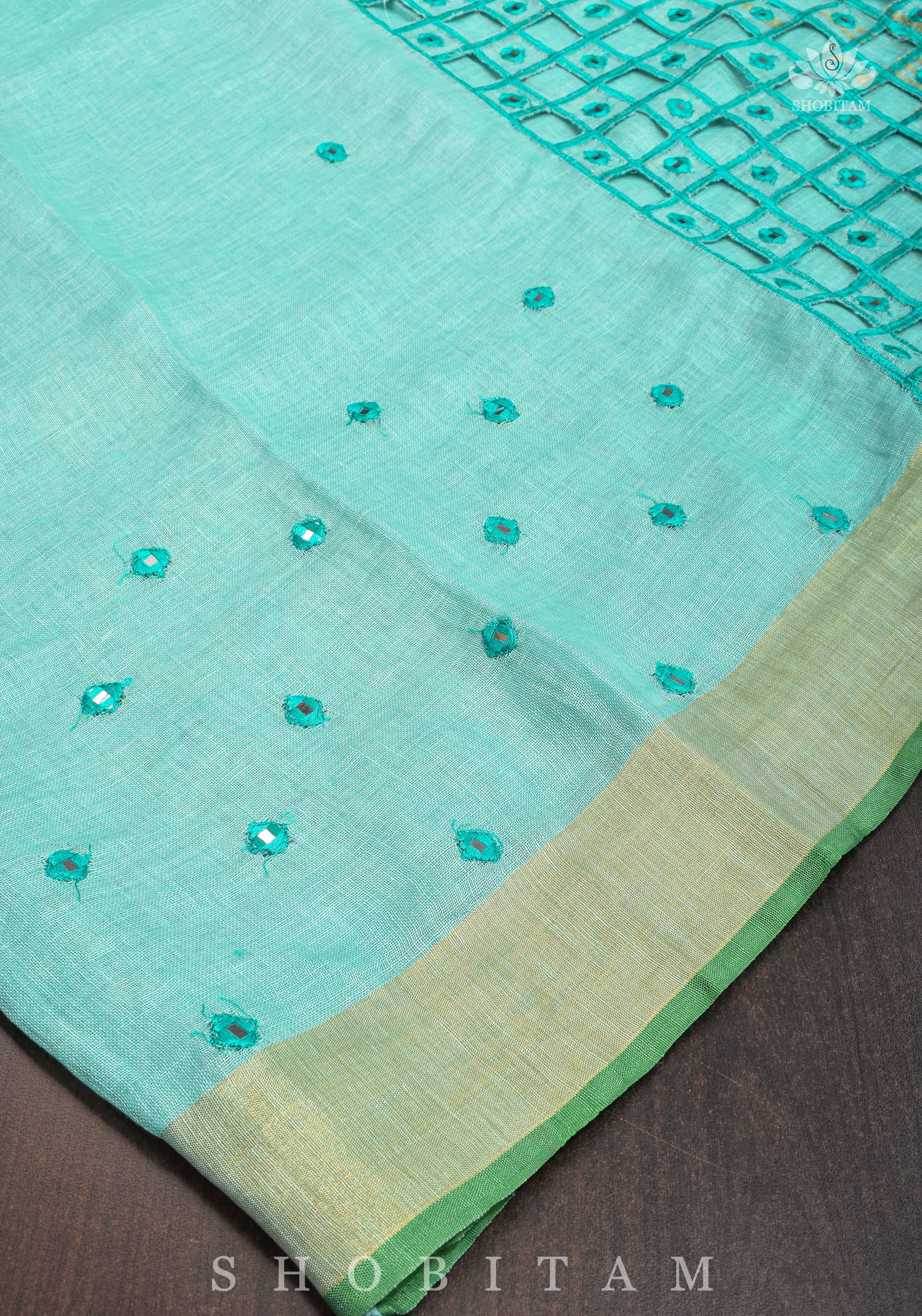 Jaali Pallu - Cutwork and Mirrorwork Saree in Linen by Linen in Teal Color | Shobitam