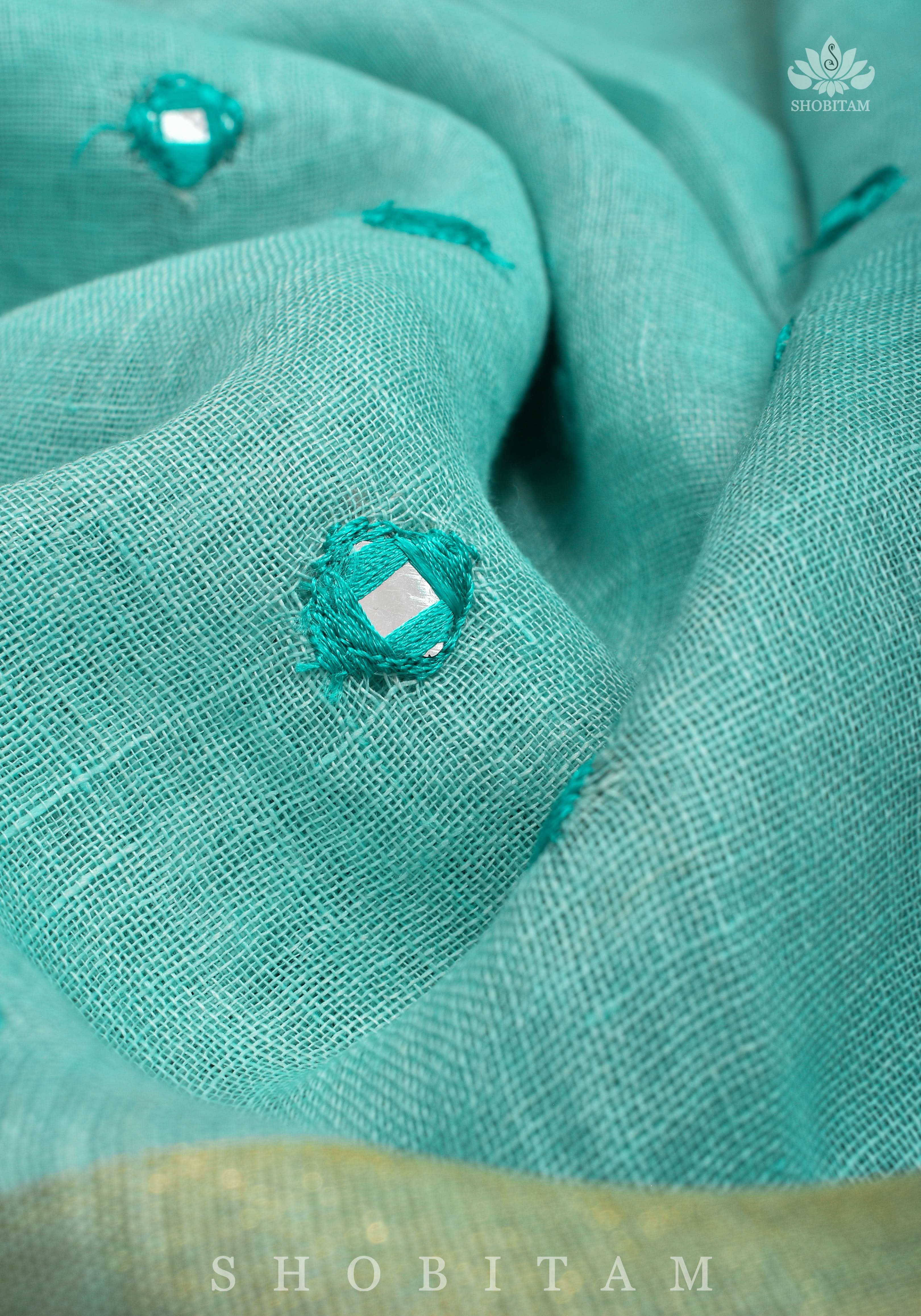 Jaali Pallu - Cutwork and Mirrorwork Saree in Linen by Linen in Teal Color | Shobitam