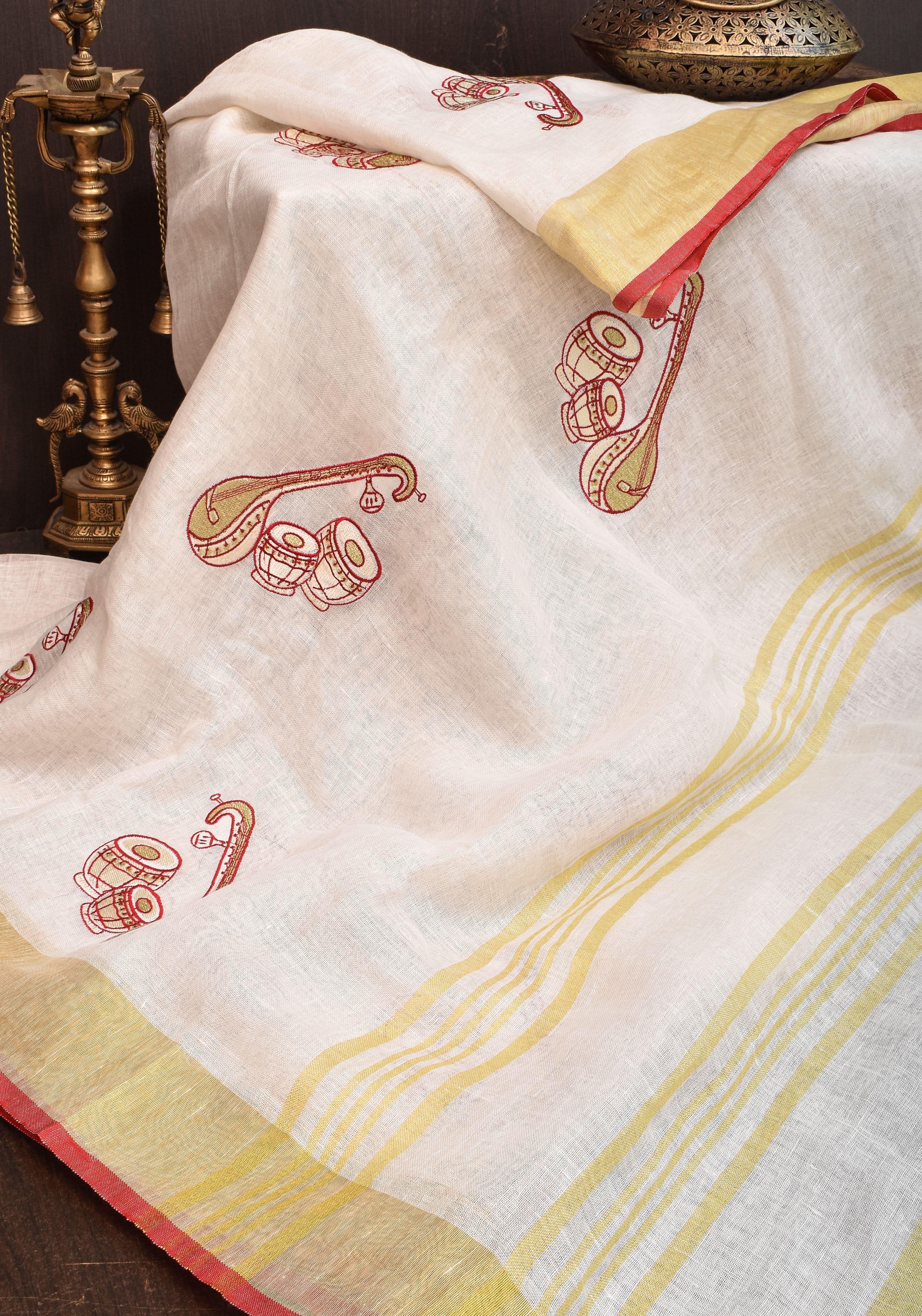 Linen by Linen Saree in White with Musical instruments embroidery motifs | Shobitam