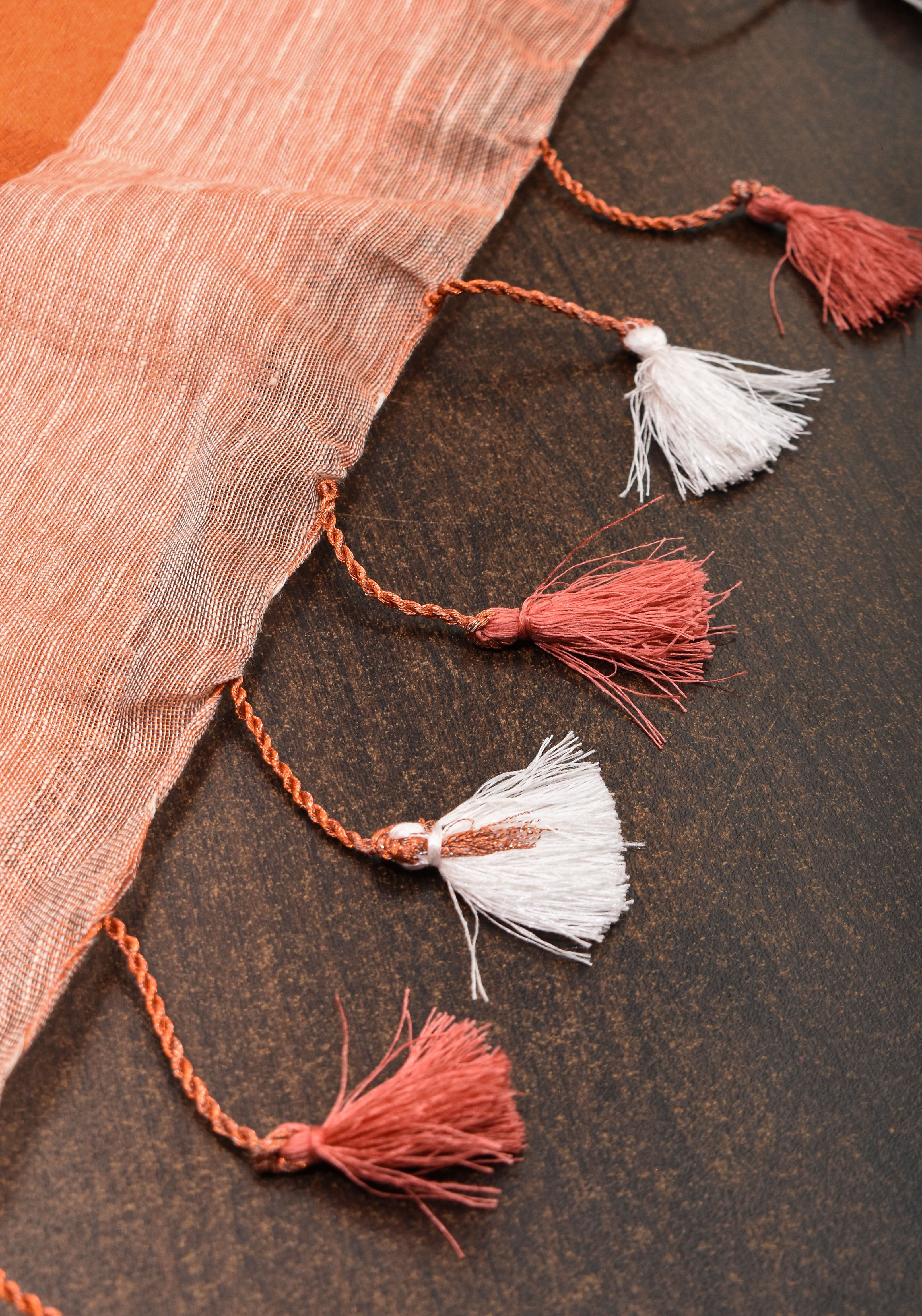 Peach Copper Tissue Linen Saree with Chunri Buttas and Tissue Pallu | Shobitam