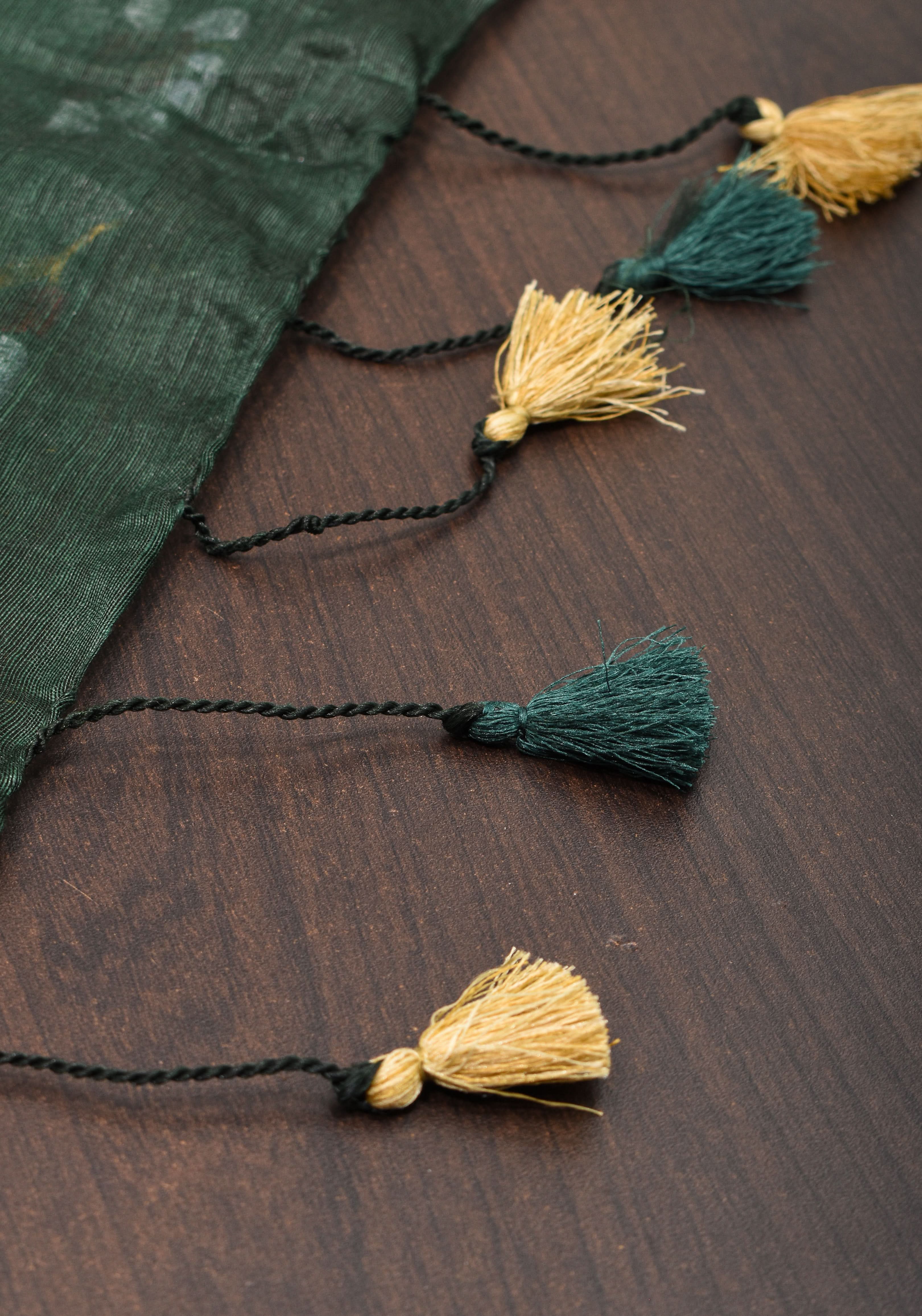 Hunter Green Silk Linen Saree with Moti Nath Embroidery,Woven zari Borders and Long Tassels | Shobitam