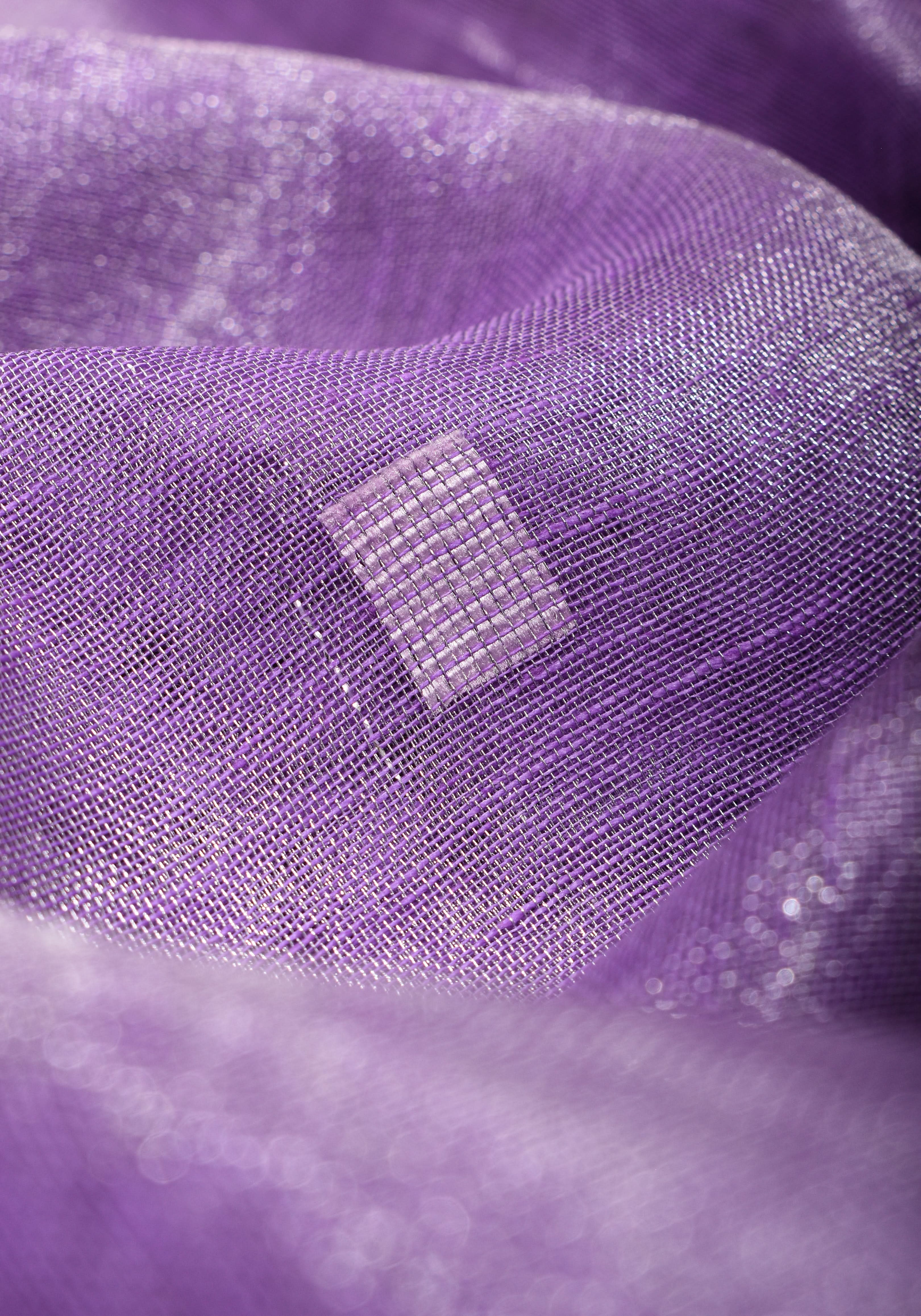 Lavender Hued Tissue Linen Saree with silver zari borders and long tassels! | Shobitam