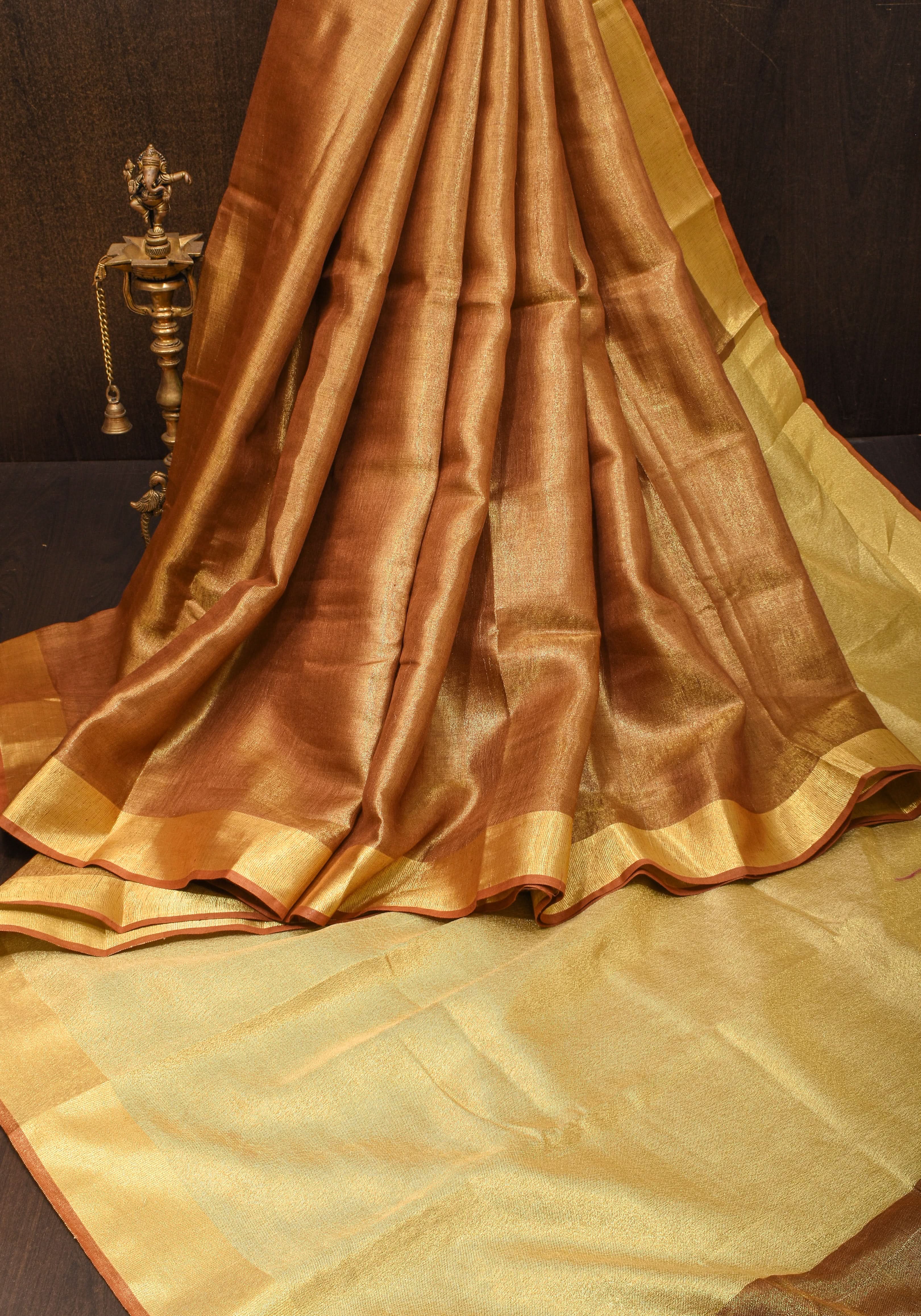 Caramel and Gold Tissue Linen Saree with Zari Border and long tassels | Shobitam