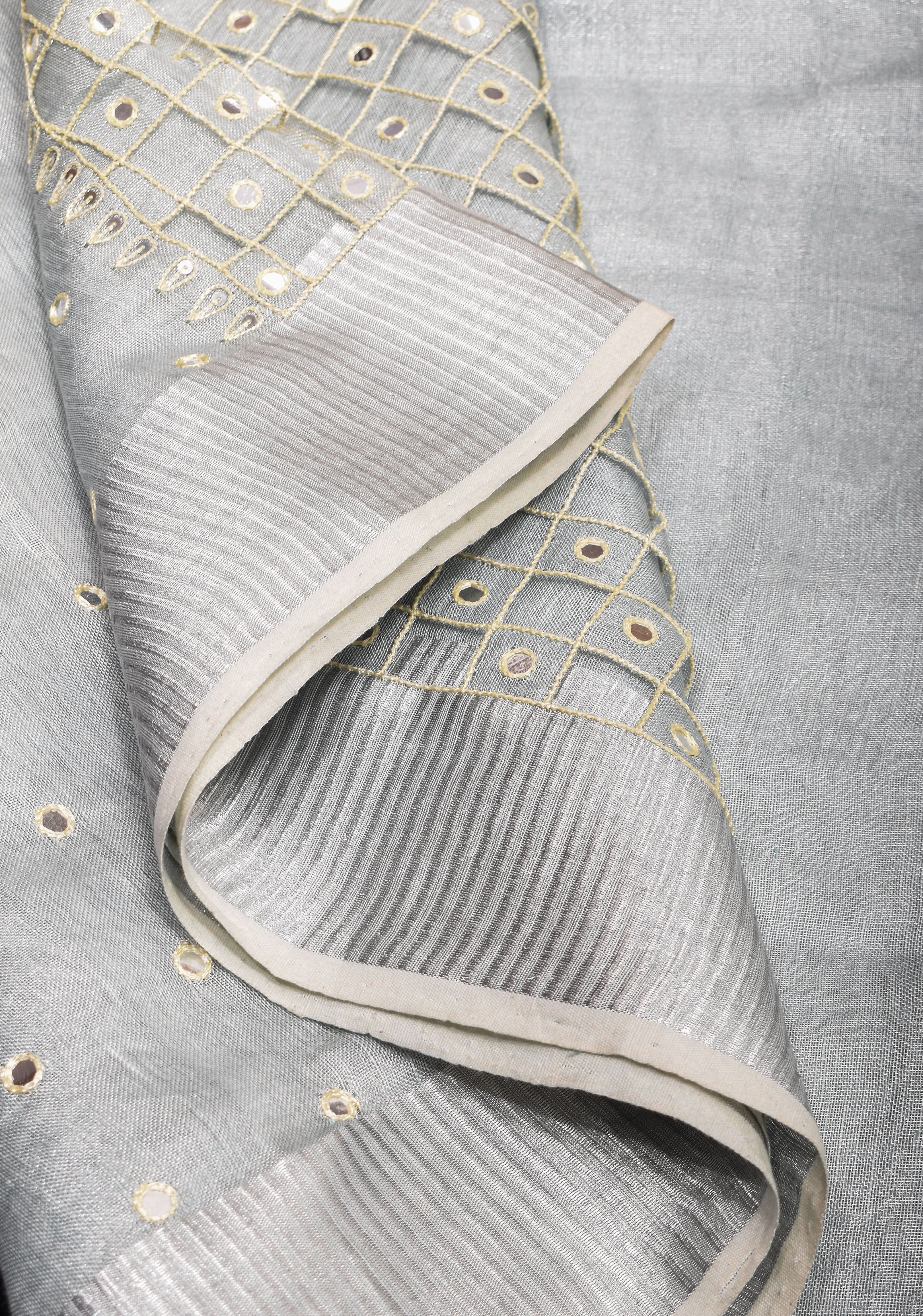 Cutwork and Mirror Work Tissue Linen Saree in White Silver with dramatic tassels | Shobitam