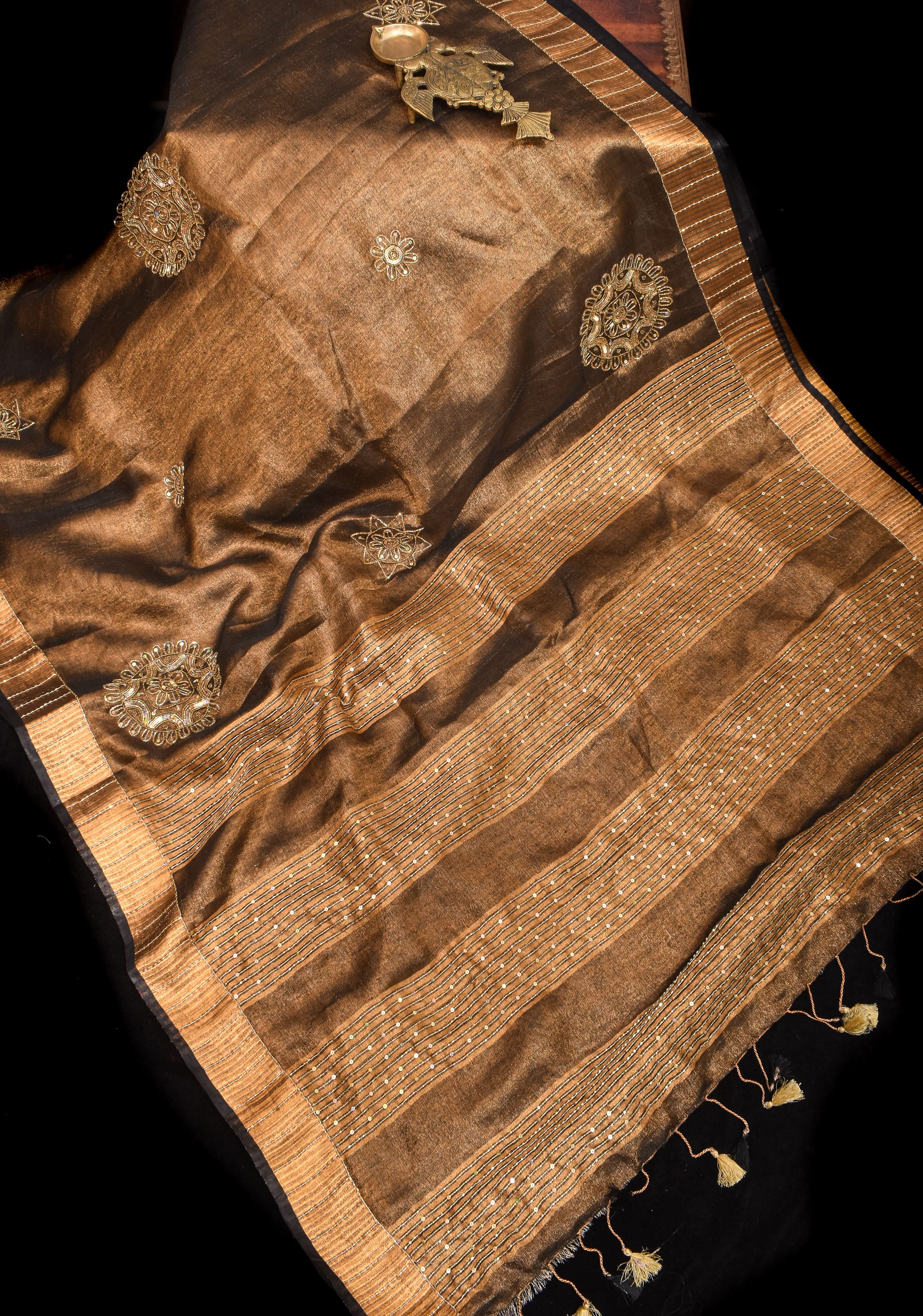 Embroidery cut dana with seqins Work Tissue Linen Saree in copper black with dramatic work Pallu | Shobitam