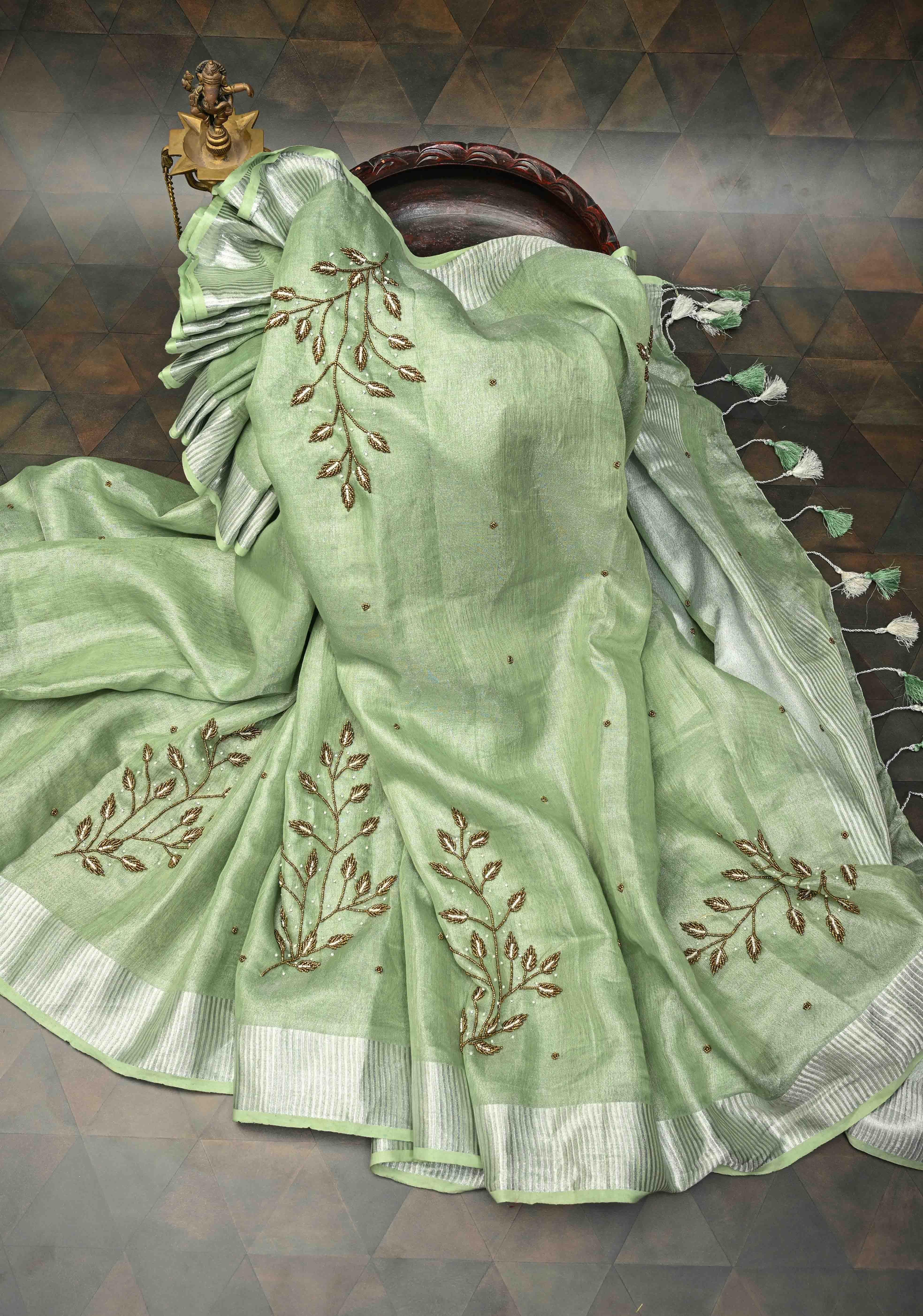 Hand Beadwork and Embroidery on Tissue Linen Saree in Sage Green and silver | Shobitam
