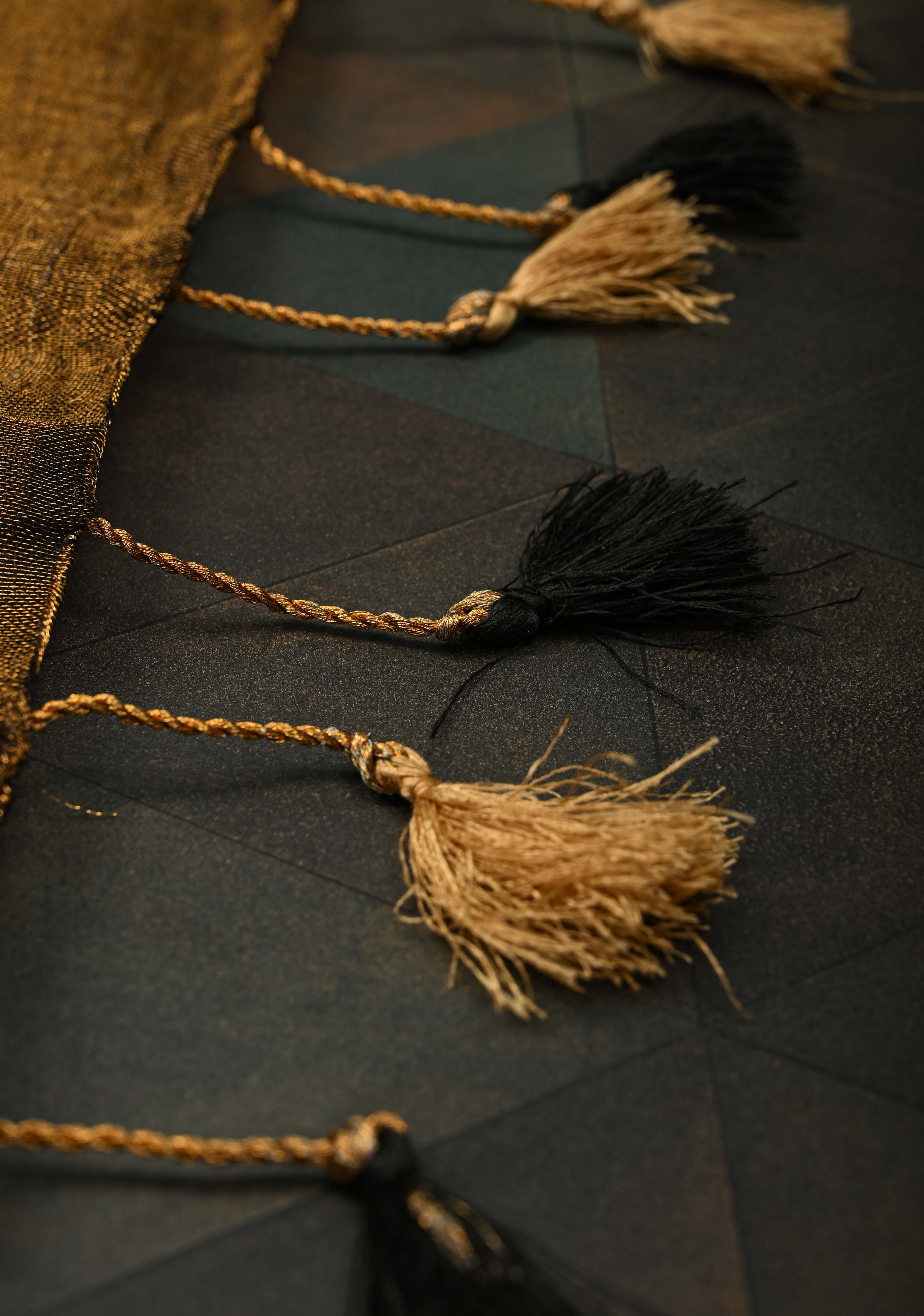 Hand Embroidery and Beadwork in copper and Black on Tissue Linen Saree | Shobitam