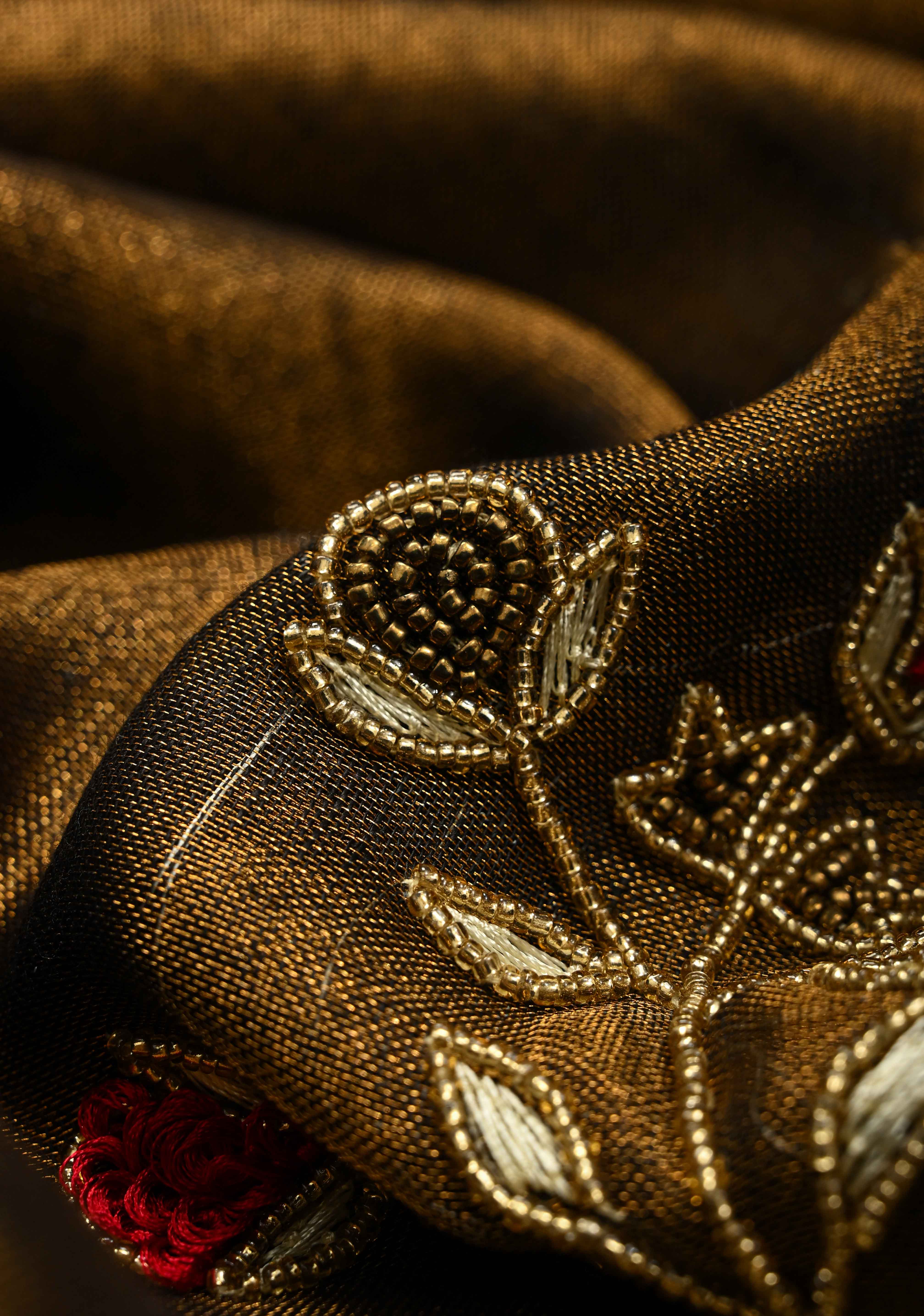 Hand Embroidery and Beadwork in copper and Black on Tissue Linen Saree | Shobitam