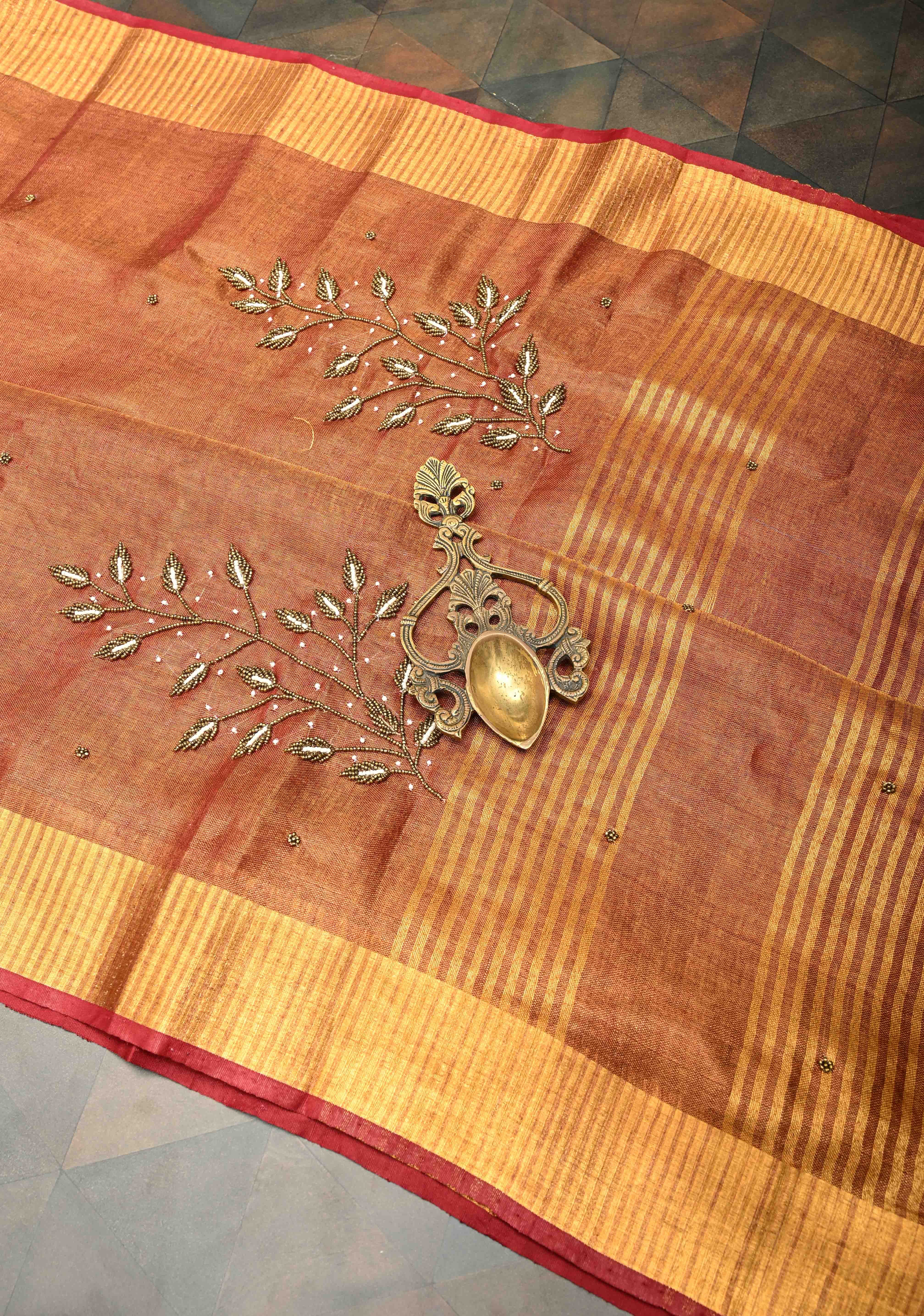 Golden Tissue Linen Saree in Reddish-Brown with Bead Embellishments | Shobitam