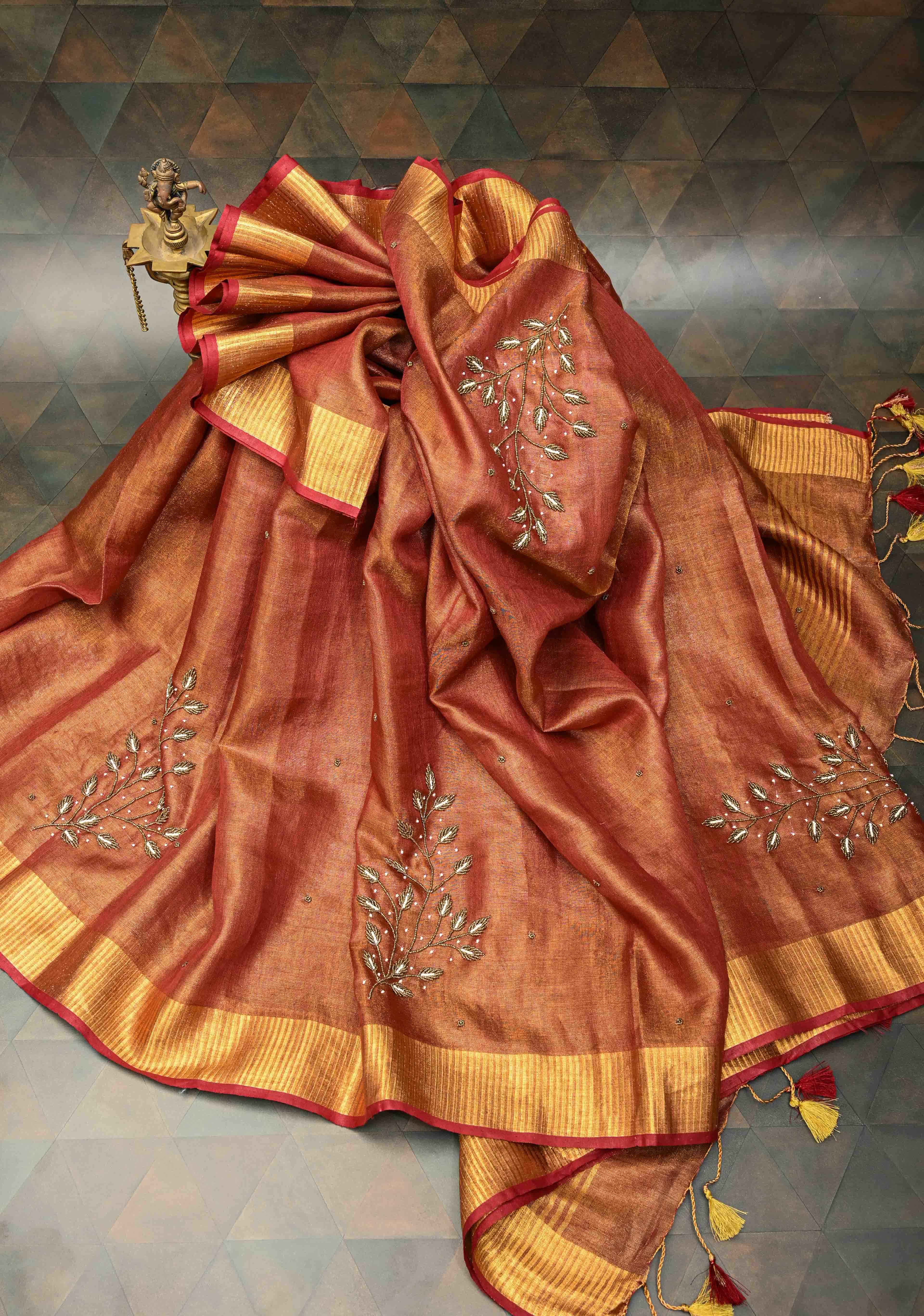 Golden Tissue Linen Saree in Reddish-Brown with Bead Embellishments | Shobitam