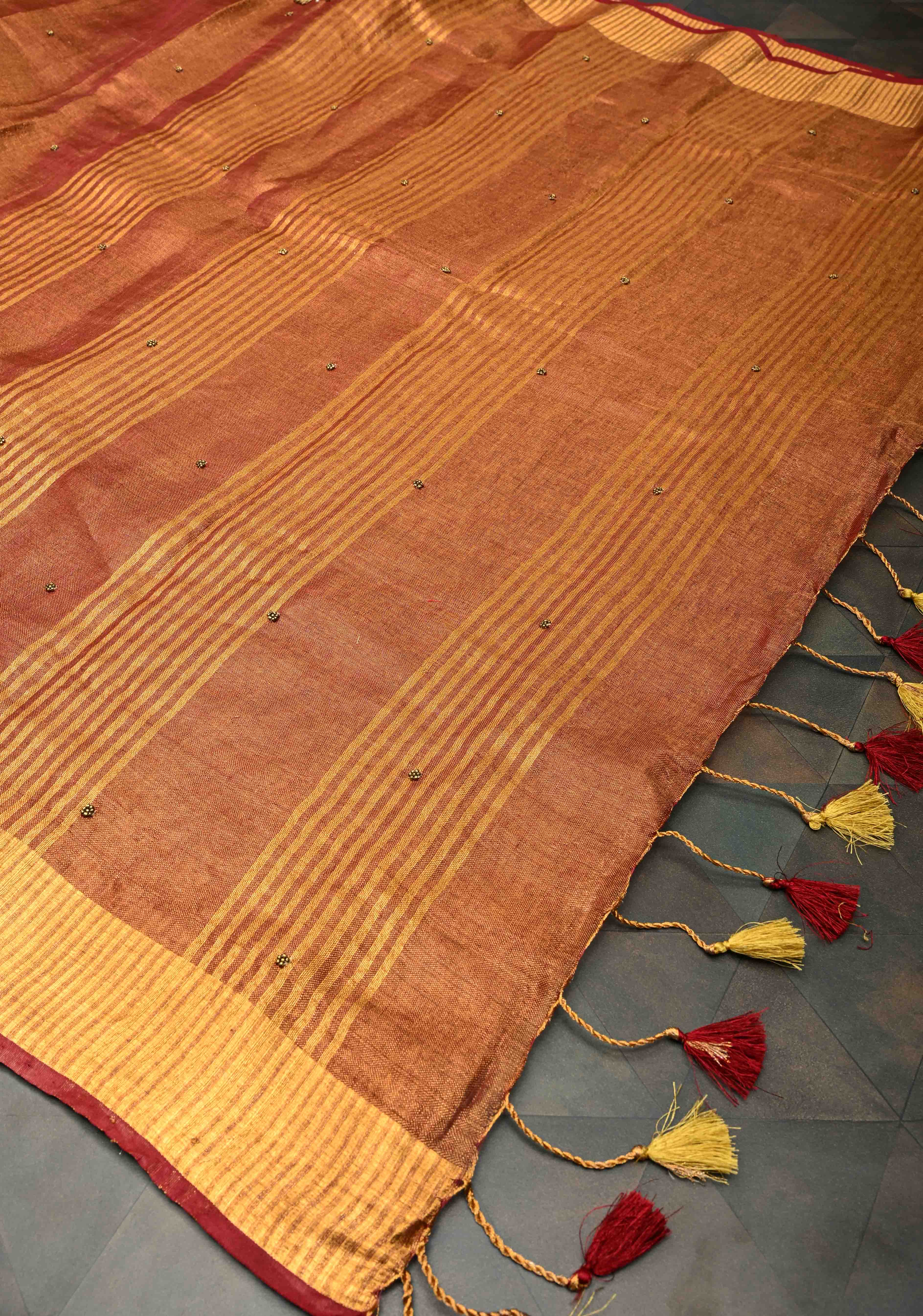 Golden Tissue Linen Saree in Reddish-Brown with Bead Embellishments | Shobitam