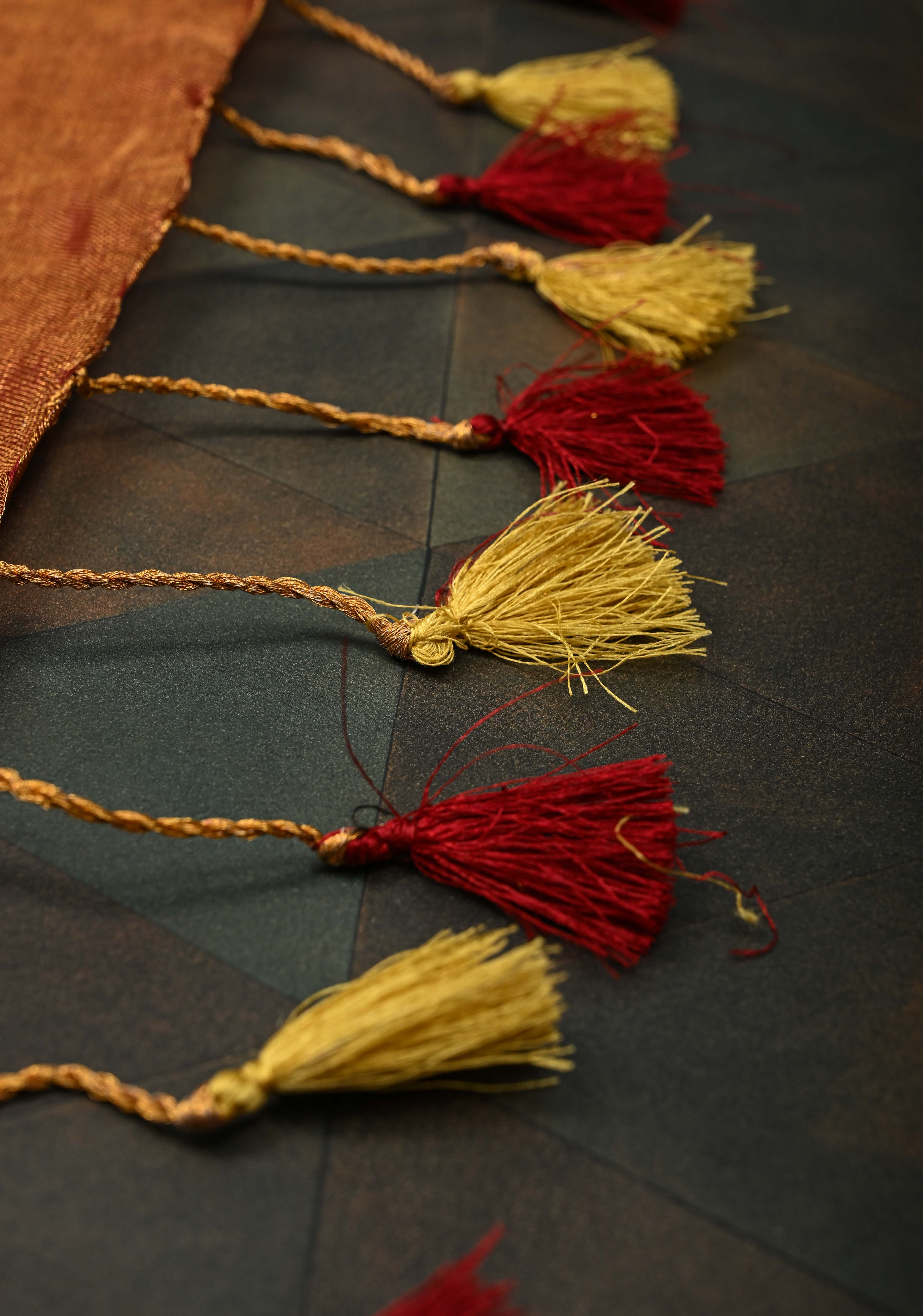 Golden Tissue Linen Saree in Reddish-Brown with Bead Embellishments | Shobitam