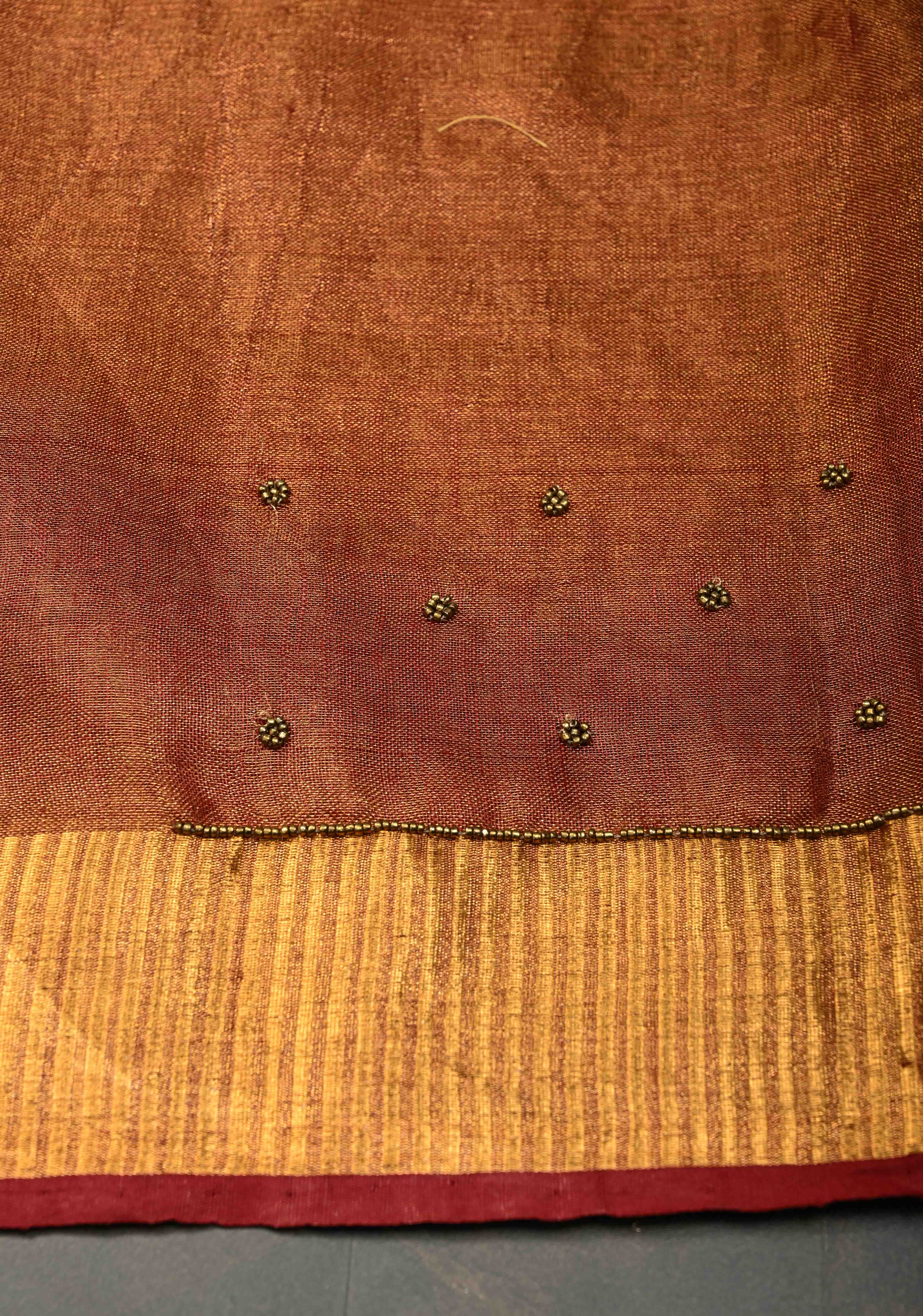 Golden Tissue Linen Saree in Reddish-Brown with Bead Embellishments | Shobitam