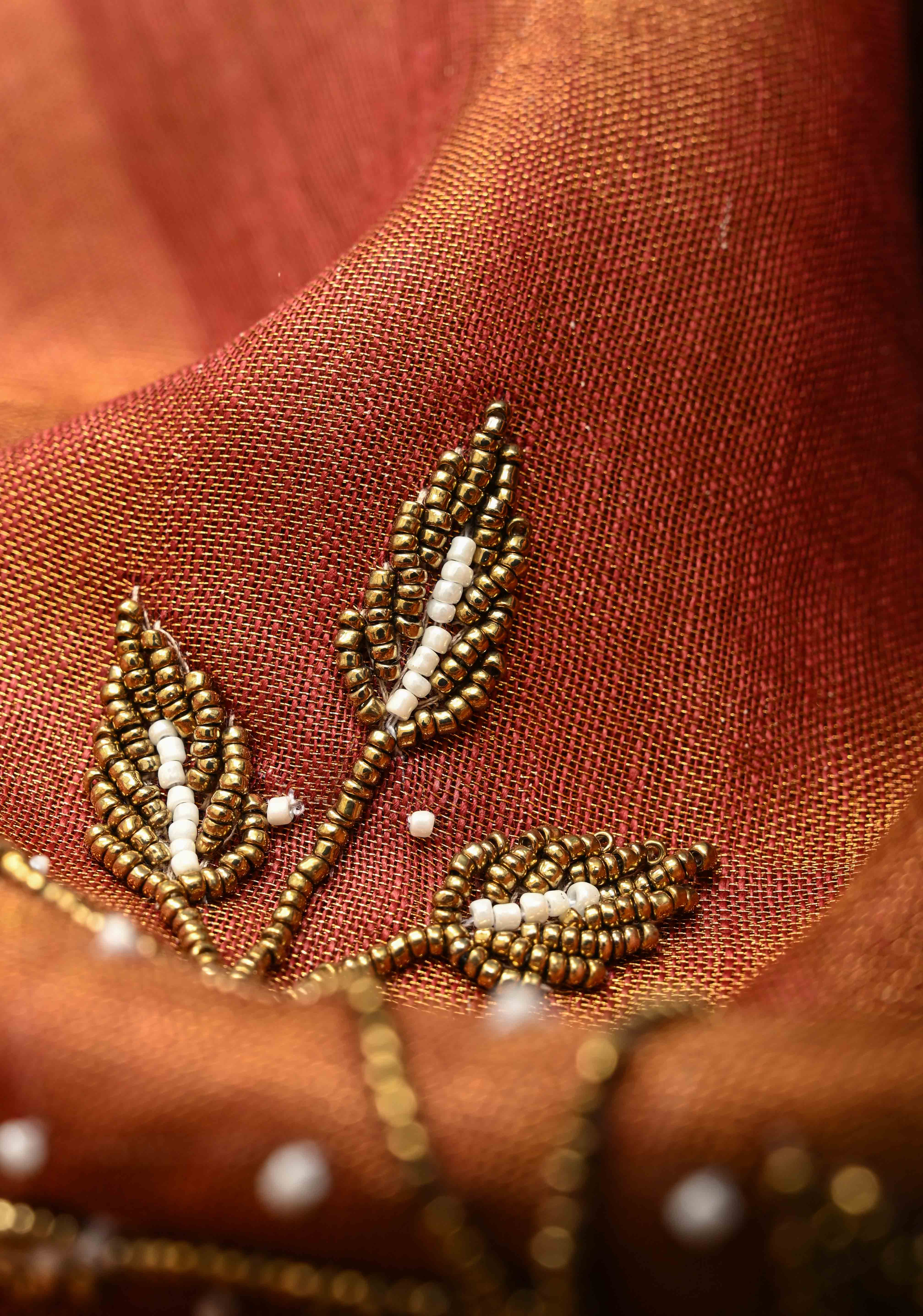 Golden Tissue Linen Saree in Reddish-Brown with Bead Embellishments | Shobitam