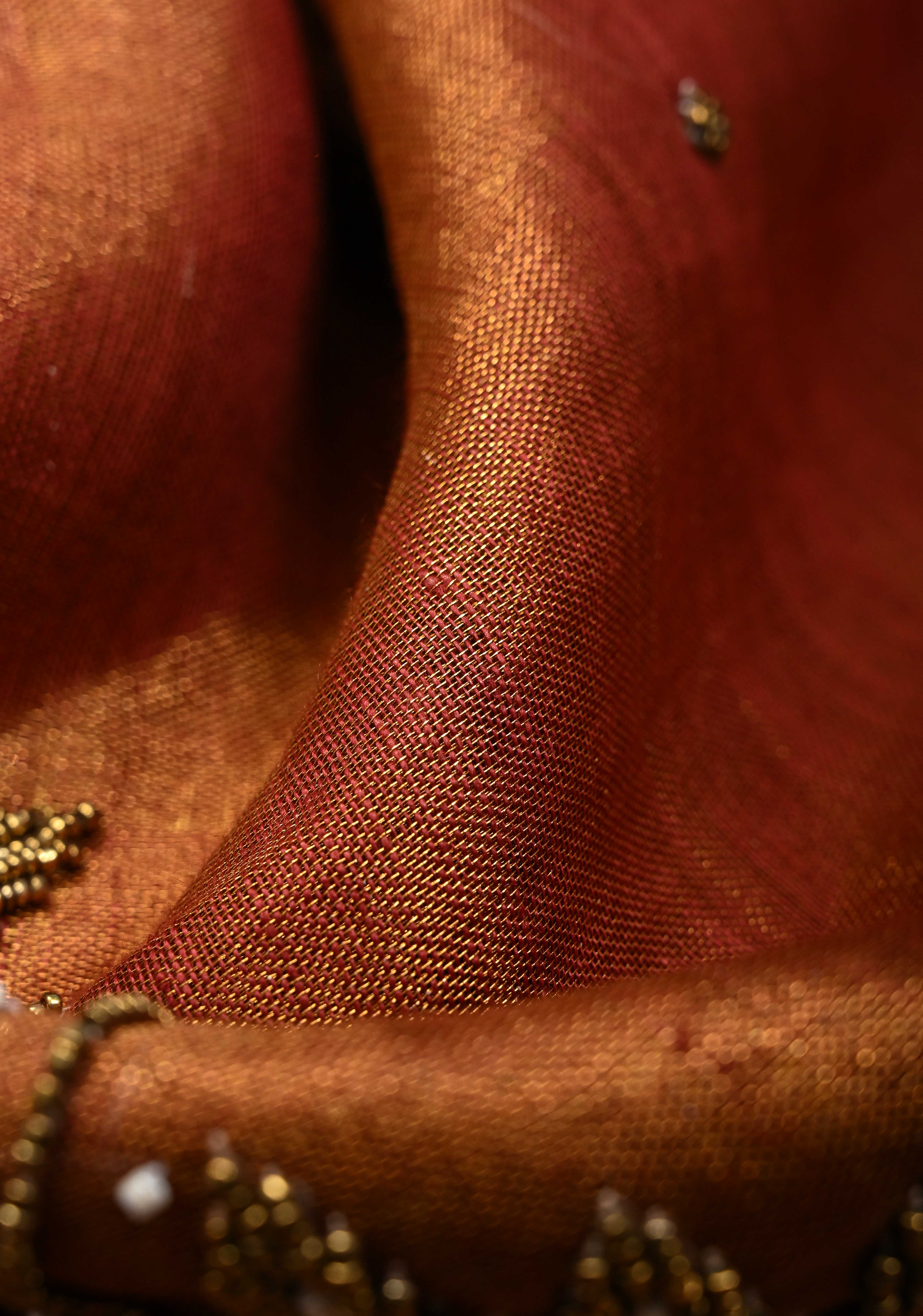 Golden Tissue Linen Saree in Reddish-Brown with Bead Embellishments | Shobitam