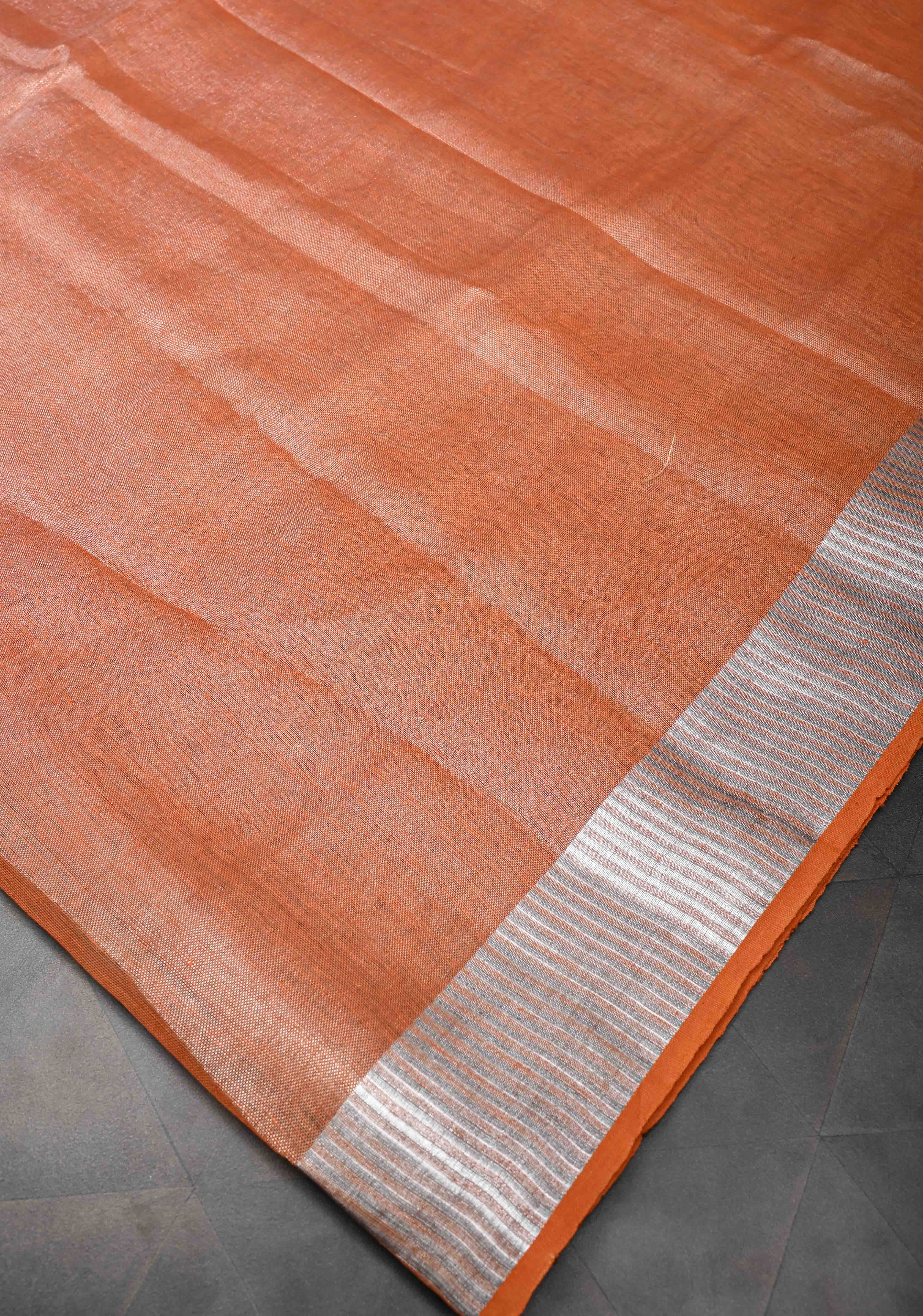 Orange Tissue Linen Saree with Silver Zari Border