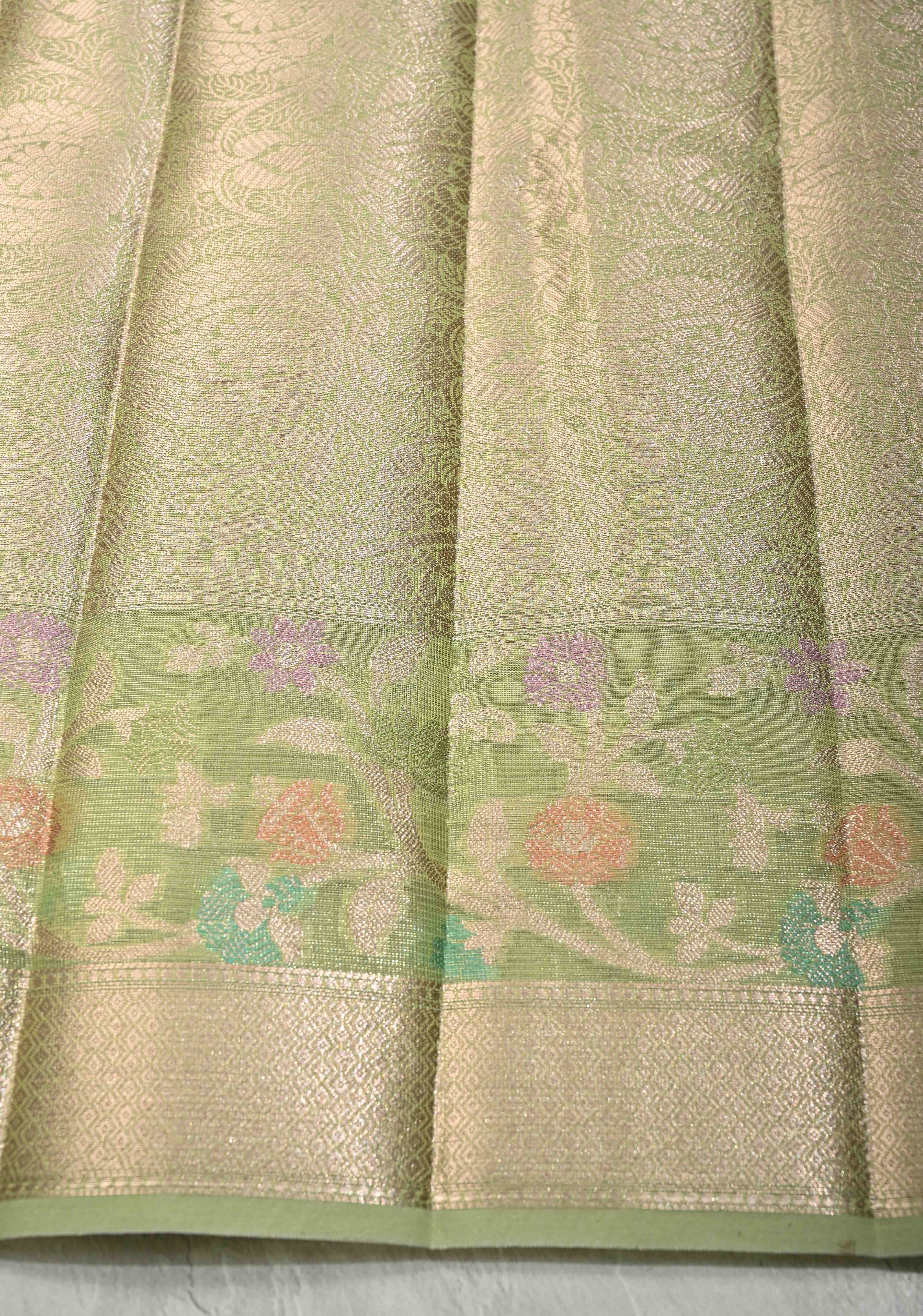 Light olive Green Tissue Kanjivaram Semi Silk Saree with Leaf Buttas and Pastel meenakari Vine border | Shobitam