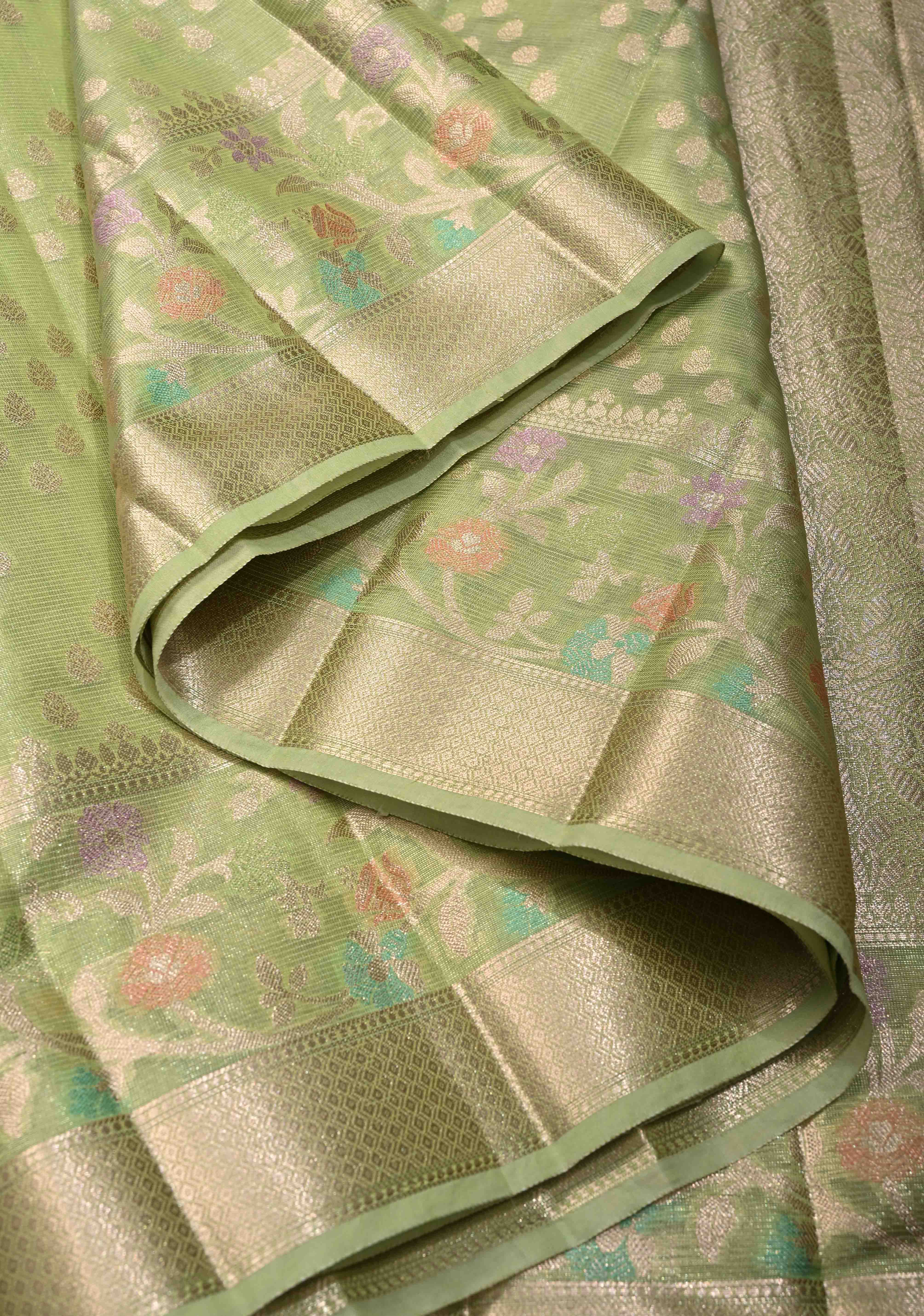 Light olive Green Tissue Kanjivaram Semi Silk Saree with Leaf Buttas and Pastel meenakari Vine border | Shobitam