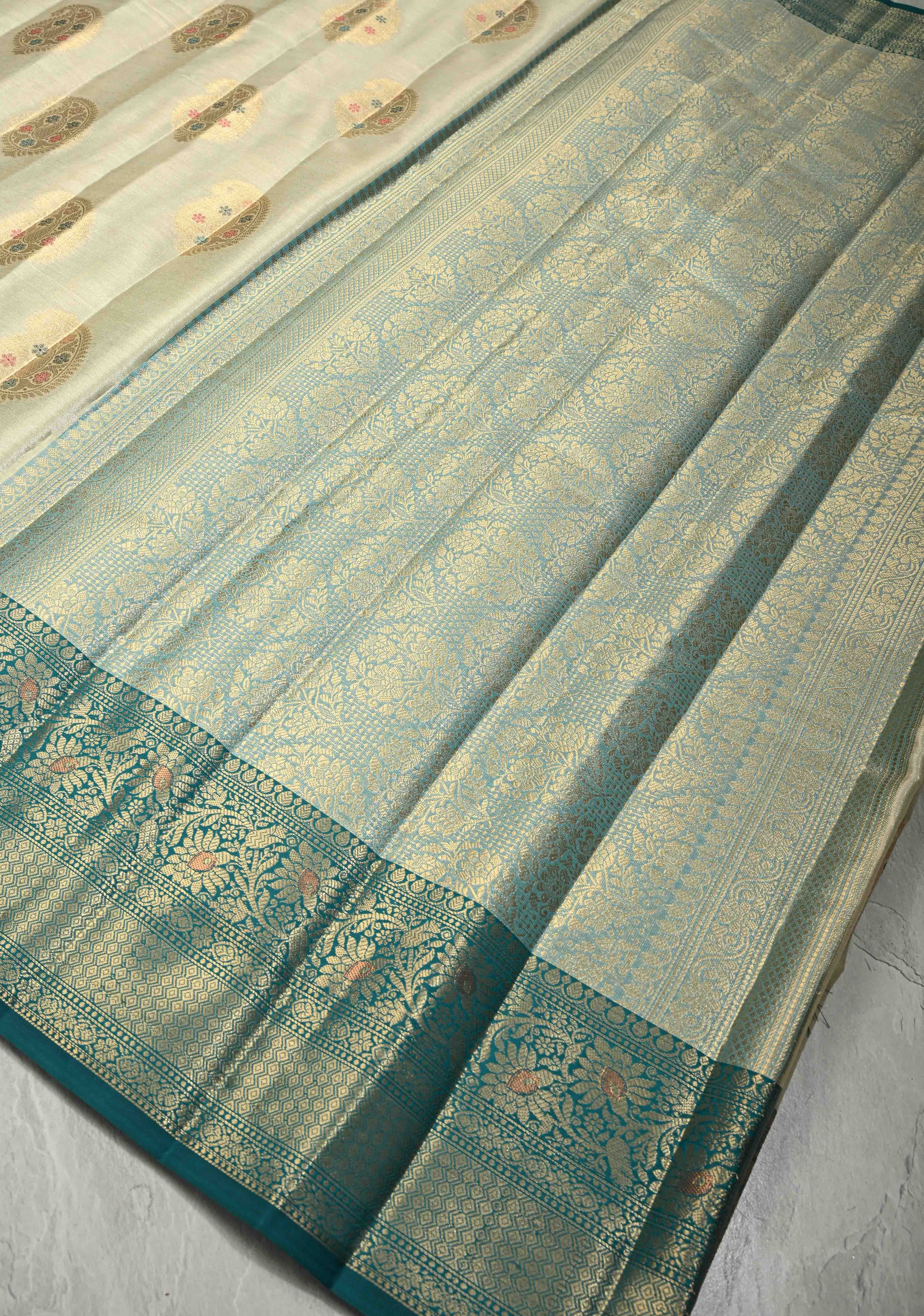 Beige Kanjivaram Tissue Semi Silk Saree with Meenakari Paisley Zari Buttas and Contrast Zari Border | Shobitam