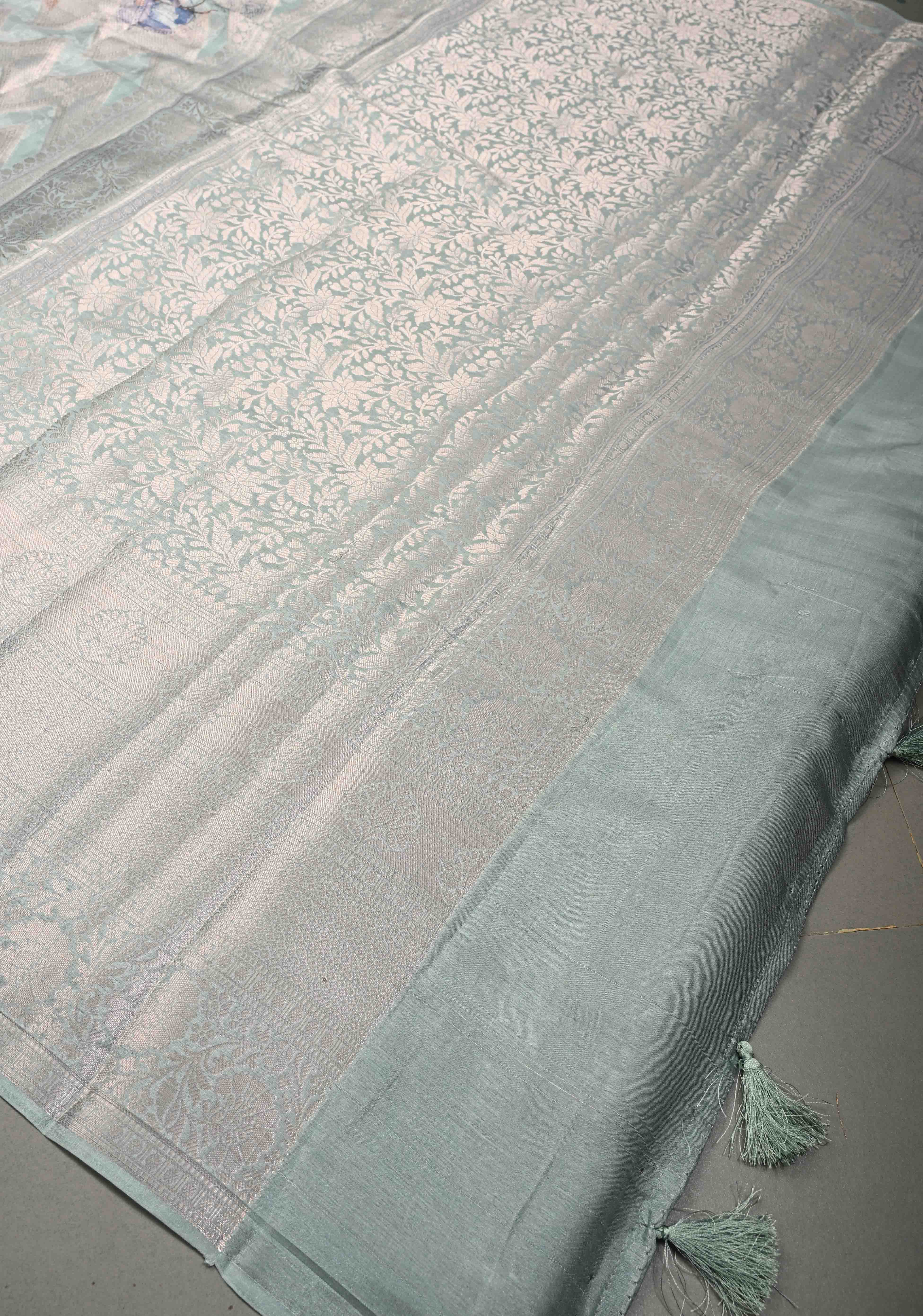 Pastel Sage Green Floral Digital Print on Banarasi Semi Silk Saree with Muted Zari Chevron Design and Wide Zari Border | Shobitam