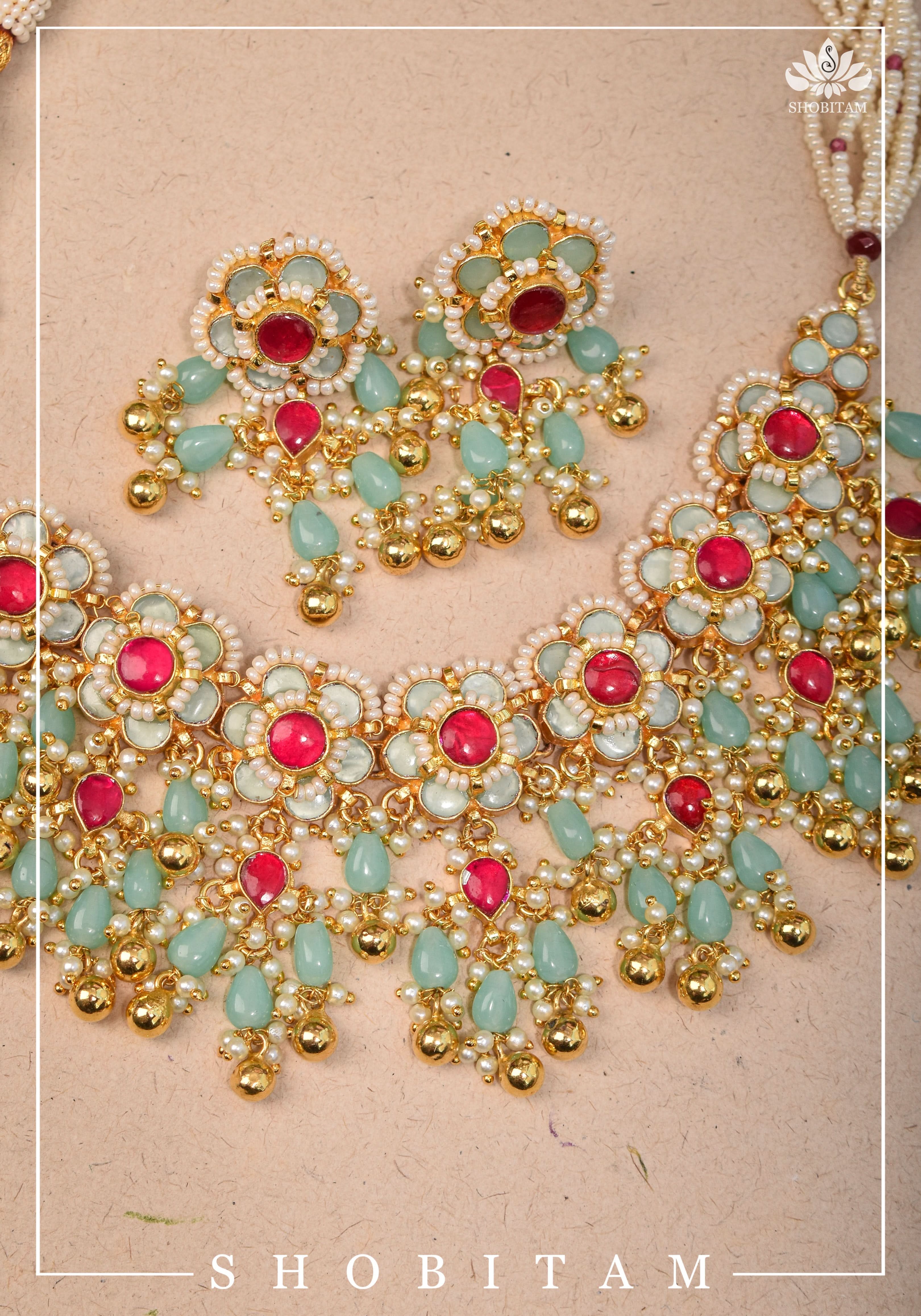 Blue tone Exquisite Jadau Floral Design Jewelry Choker set with blue and gold dangling beads | Shobitam Jewelery