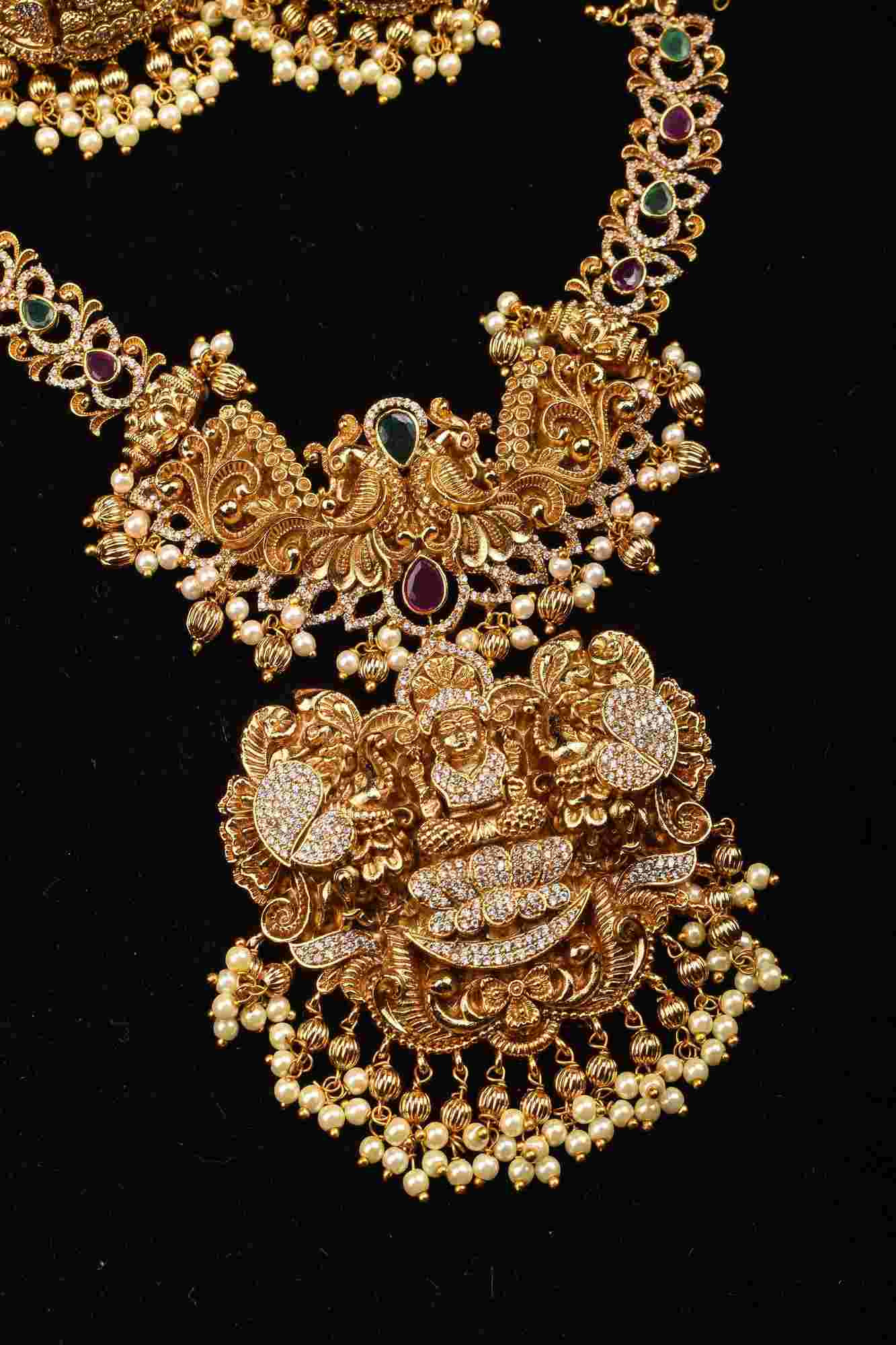 Stunning Antique Gold Finish Temple Necklace Set with Goddess Lakshmi Pendant and Pearl Embellishments