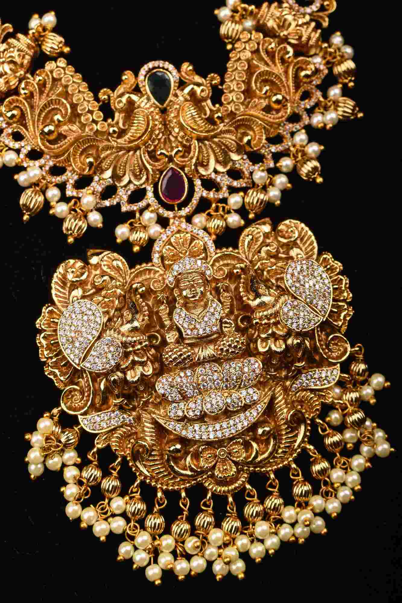 Stunning Antique Gold Finish Temple Necklace Set with Goddess Lakshmi Pendant and Pearl Embellishments