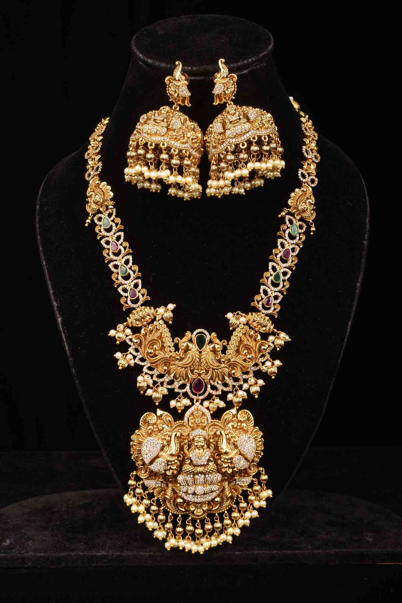 Stunning Antique Gold Finish Temple Necklace Set with Goddess Lakshmi Pendant and Pearl Embellishments