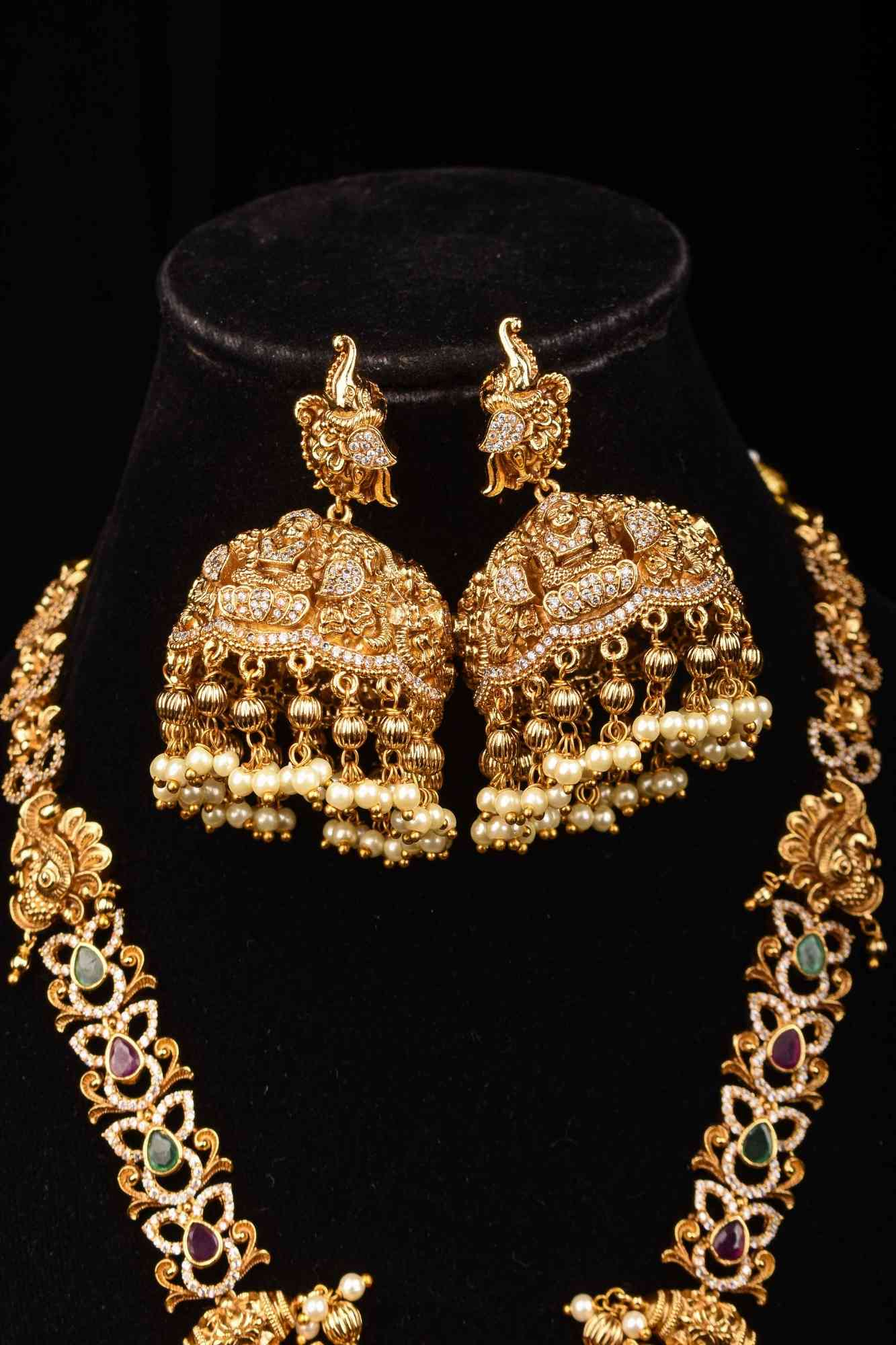Stunning Antique Gold Finish Temple Necklace Set with Goddess Lakshmi Pendant and Pearl Embellishments