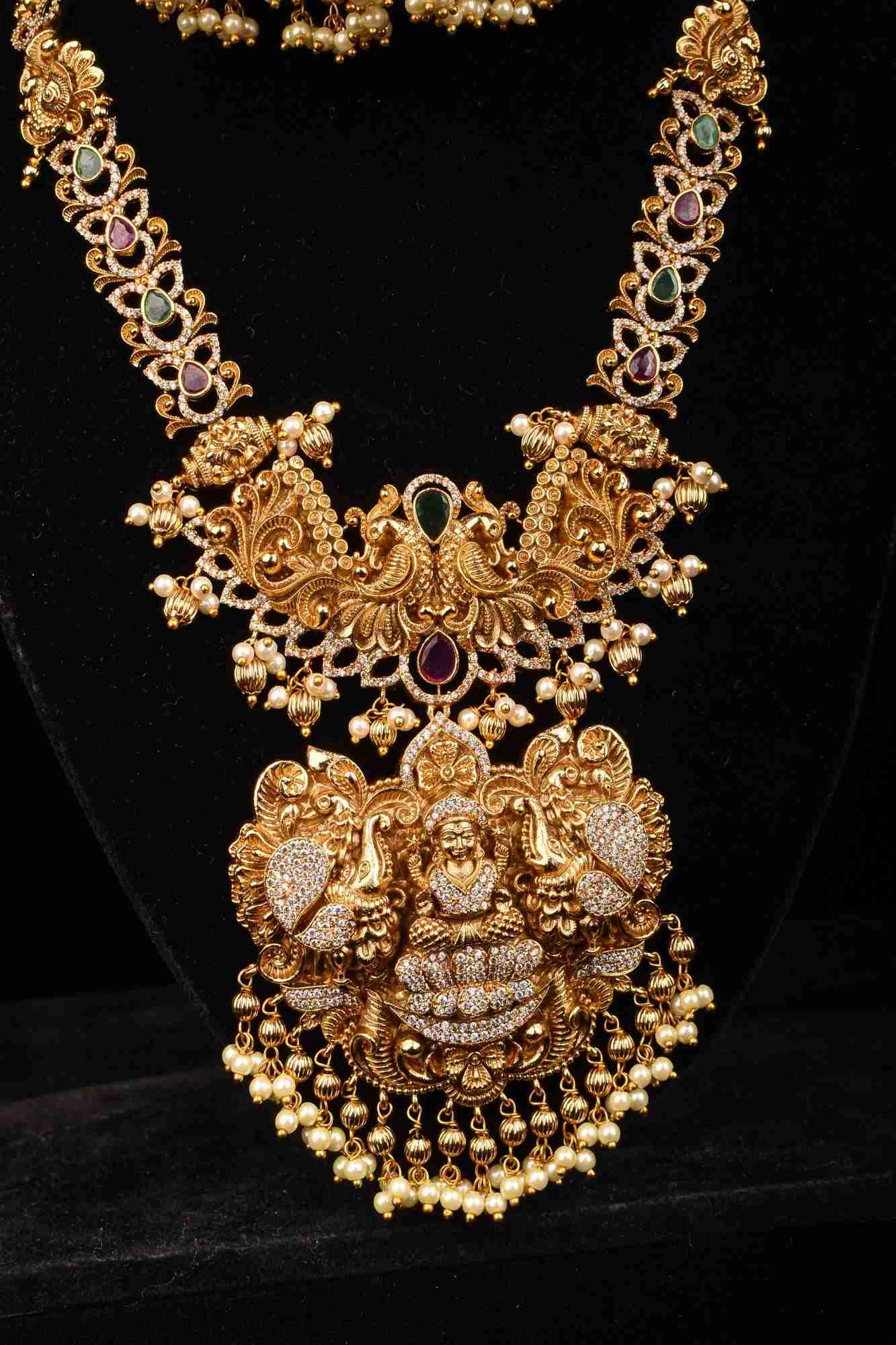 Stunning Antique Gold Finish Temple Necklace Set with Goddess Lakshmi Pendant and Pearl Embellishments