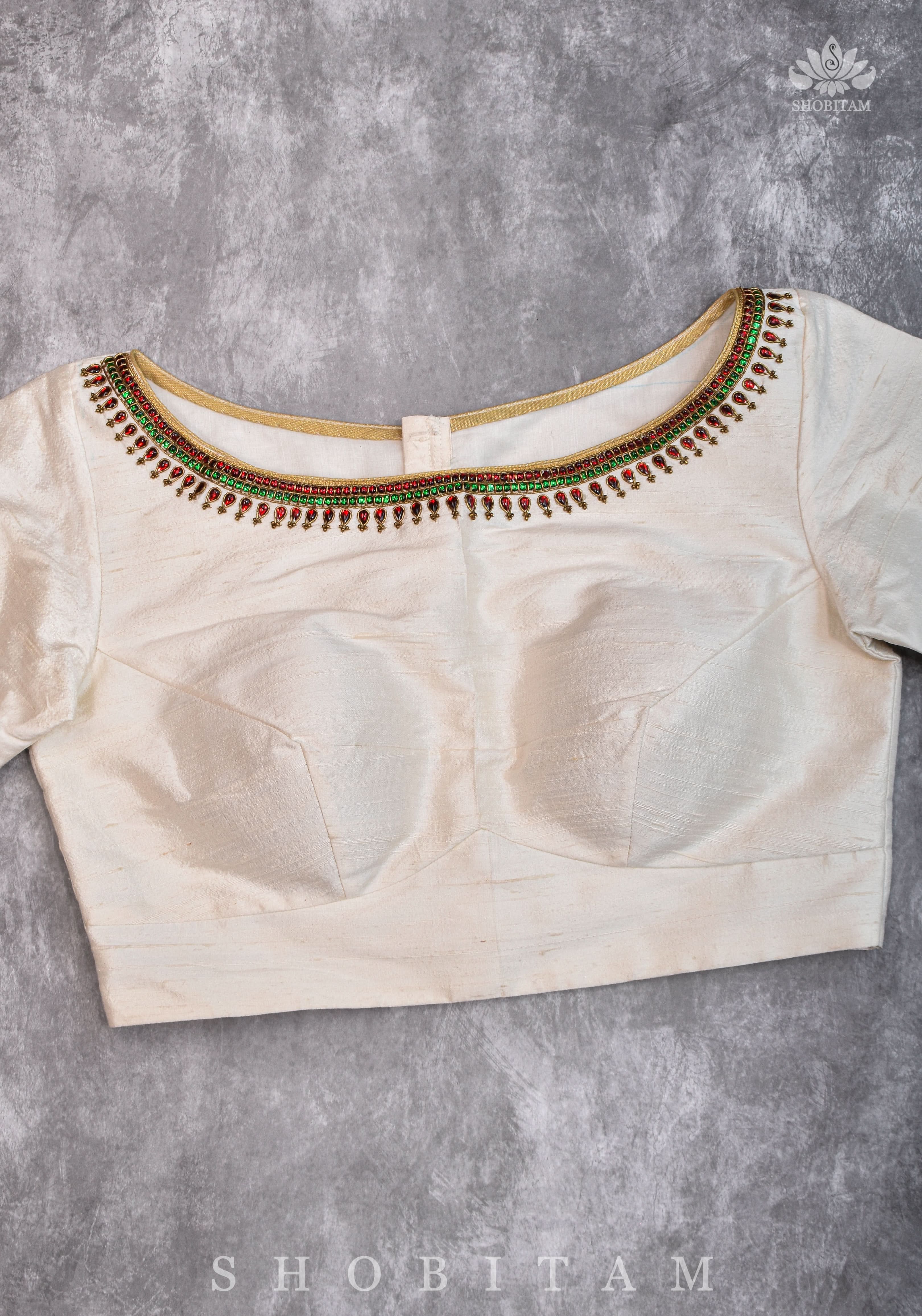 Ivory Pure Raw Silk Blouse with Kemp work detailing on boat neck and Jadau back buttons | Shobitam