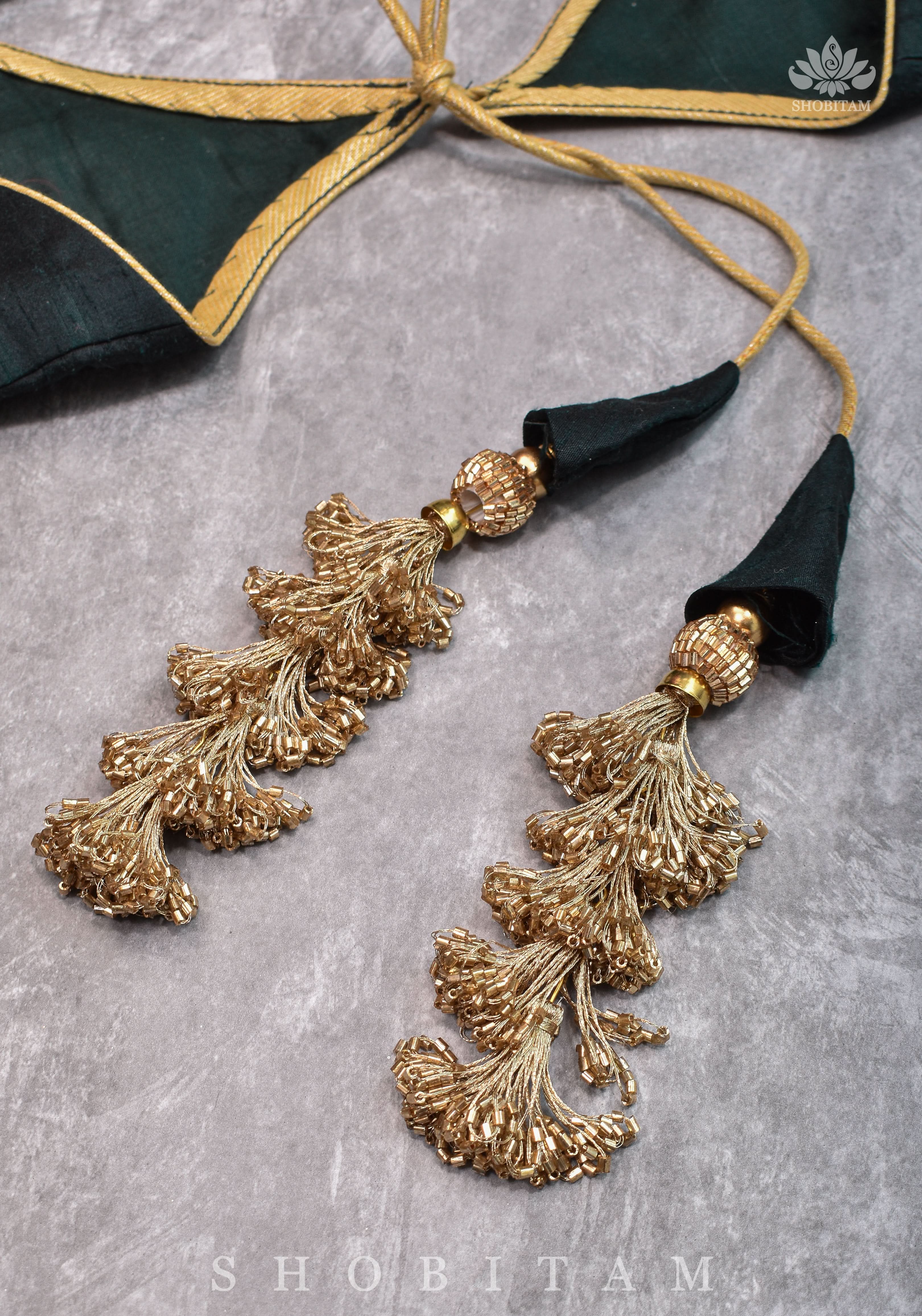 Green Pure Raw Silk Blouse with Leaf Neck, Zari detailing and Cutdana Tassels | Shobitam