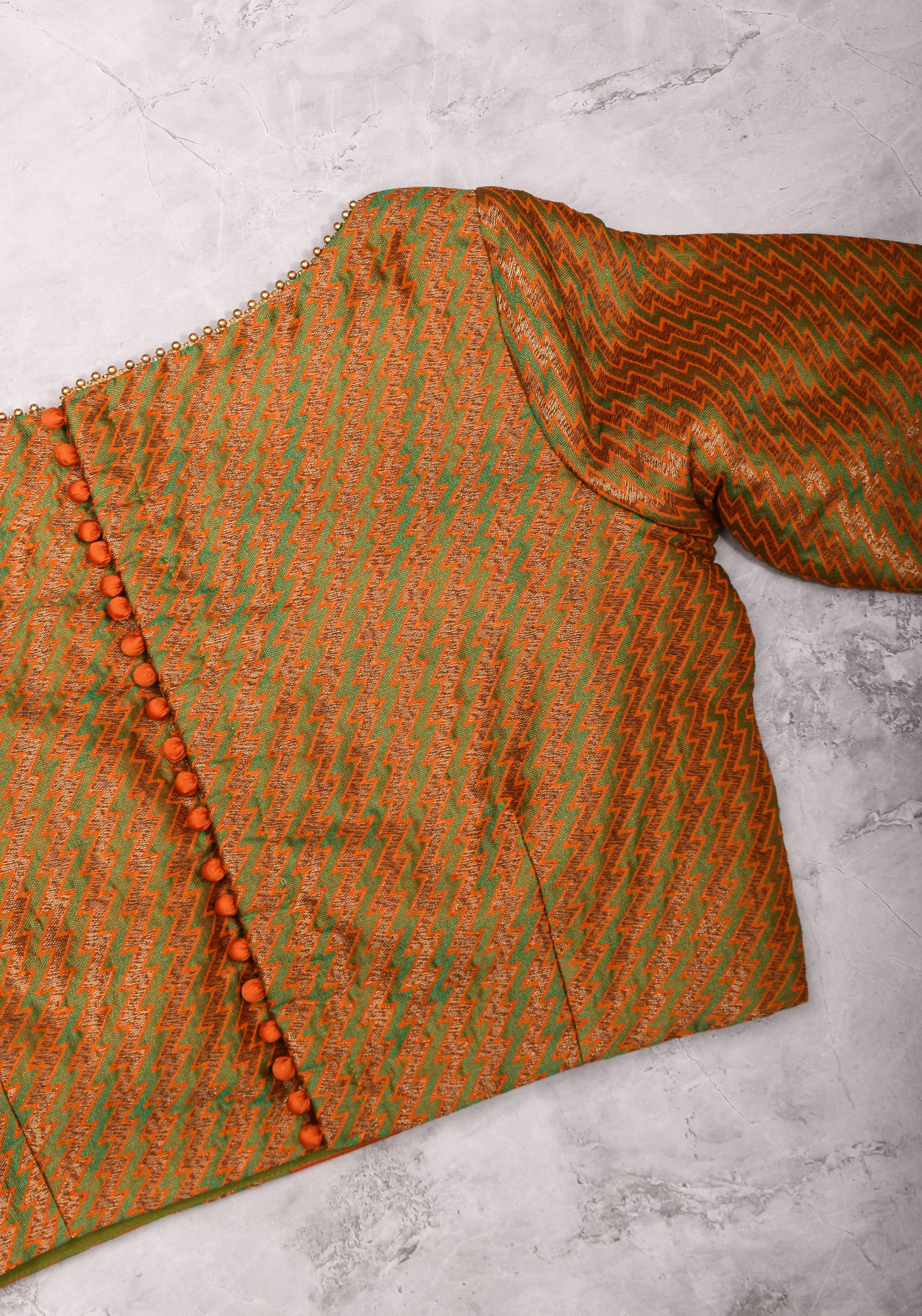 Henna Green and orange Jacquard boatneck blouse with plain silk detailing, Made to Order | Shobitam