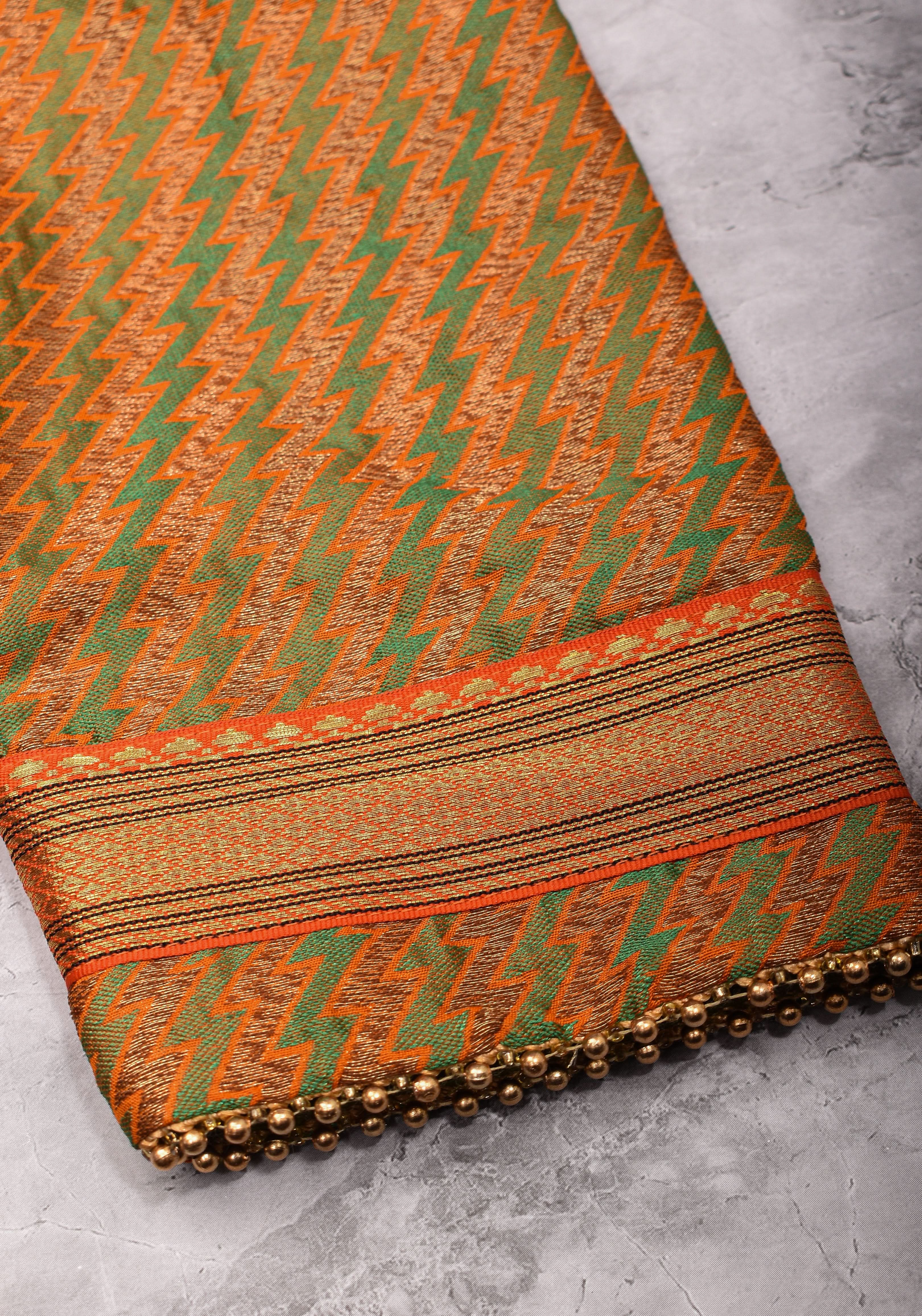 Henna Green and orange Jacquard boatneck blouse with plain silk detailing, Made to Order | Shobitam