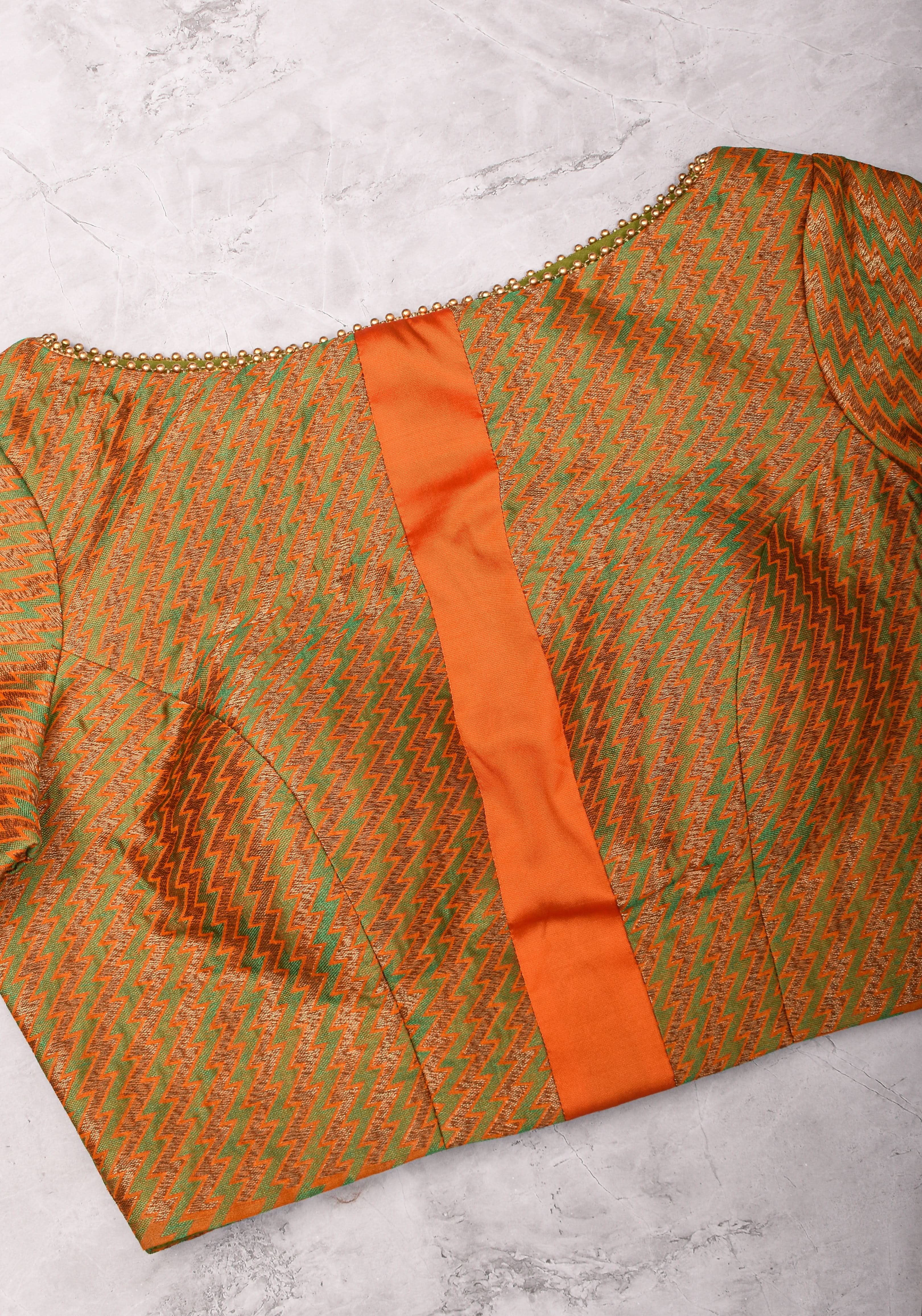 Henna Green and orange Jacquard boatneck blouse with plain silk detailing, Made to Order | Shobitam