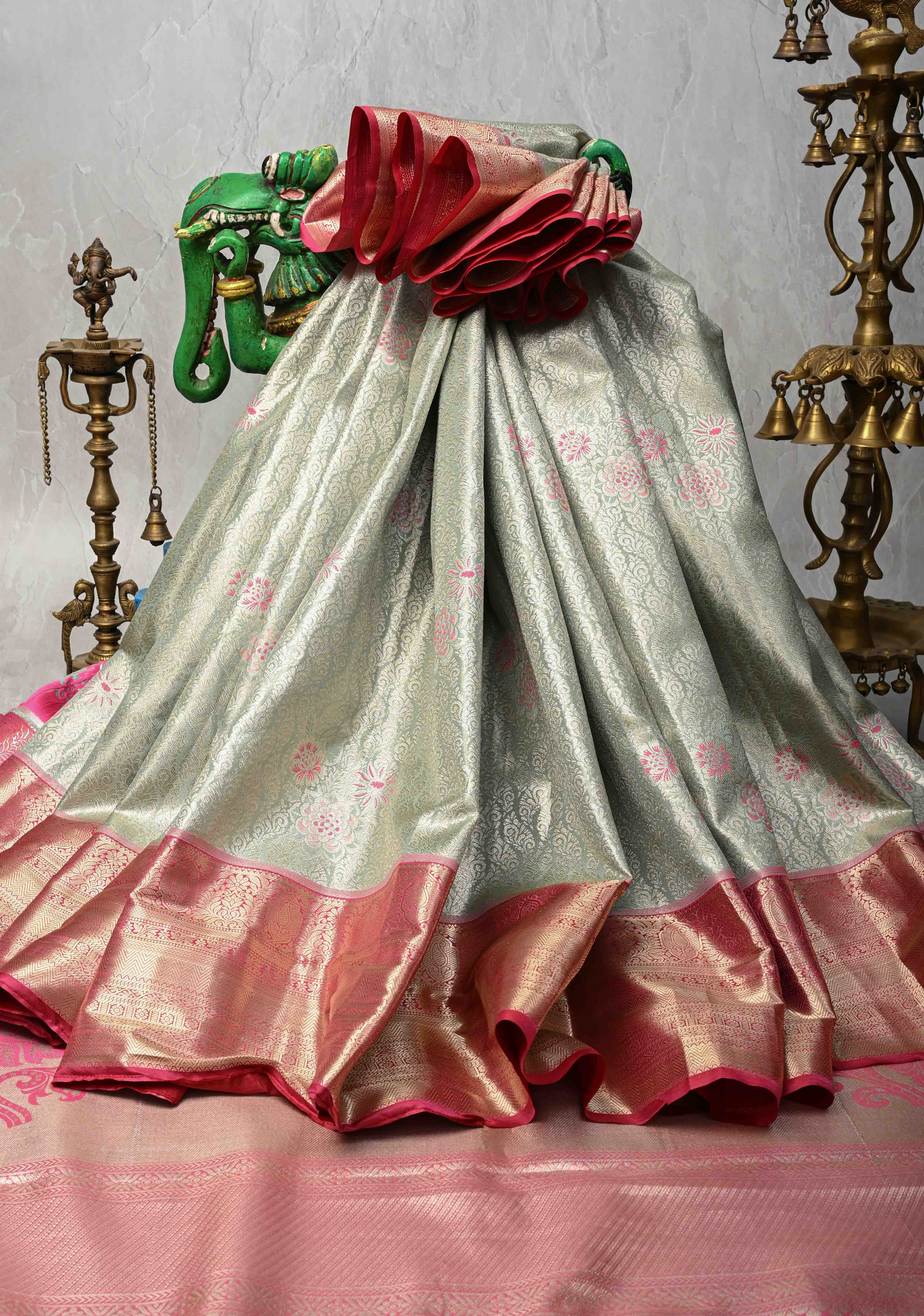 Sage Green Floral Brocade on Kanjivaram Tissue Semi Silk Saree with Meenakari Buttas and Contrast Zari Border | Shobitam