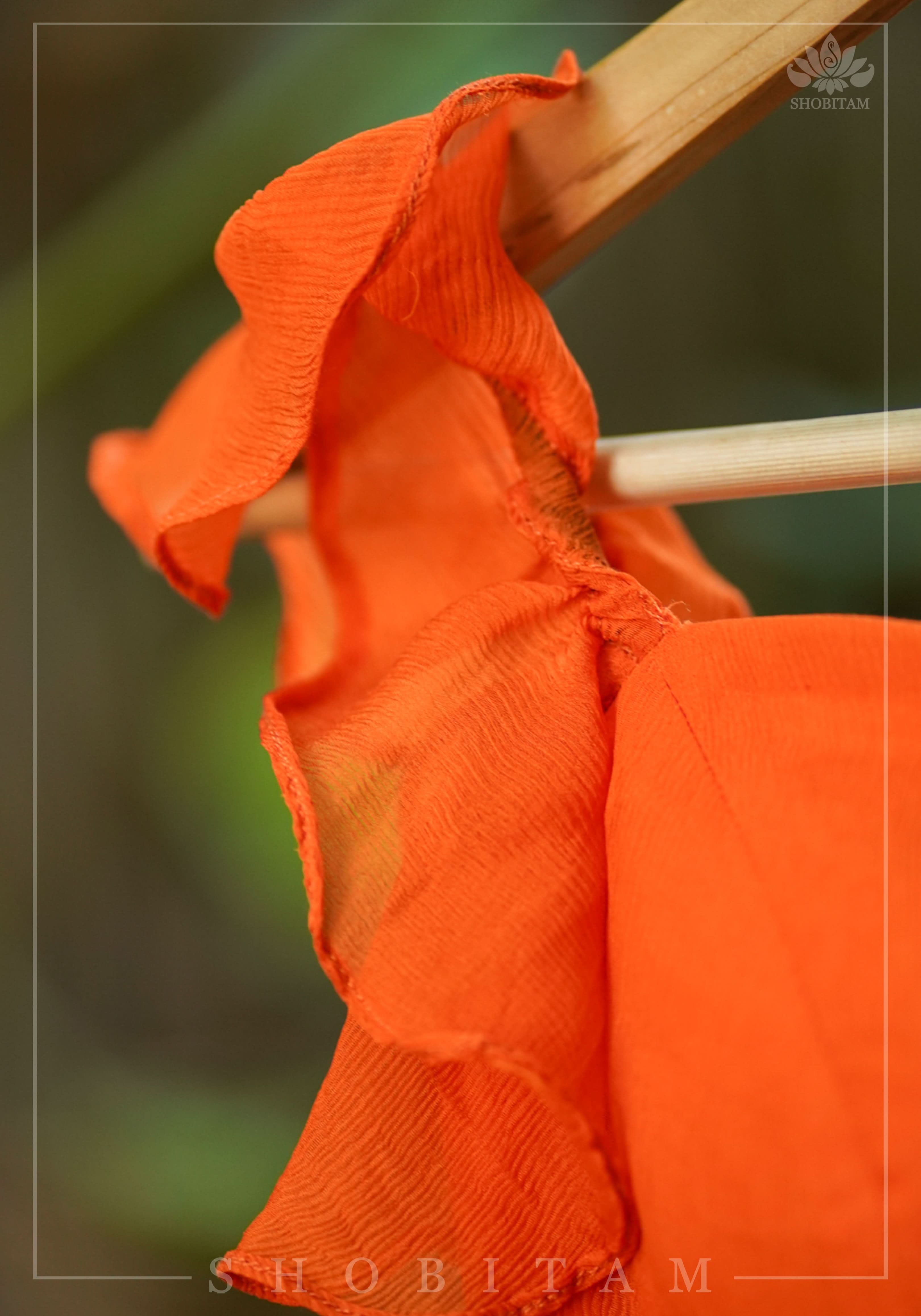 Orange chiffon sweetheart neck blouse with ruffle sleeves | Shobitam