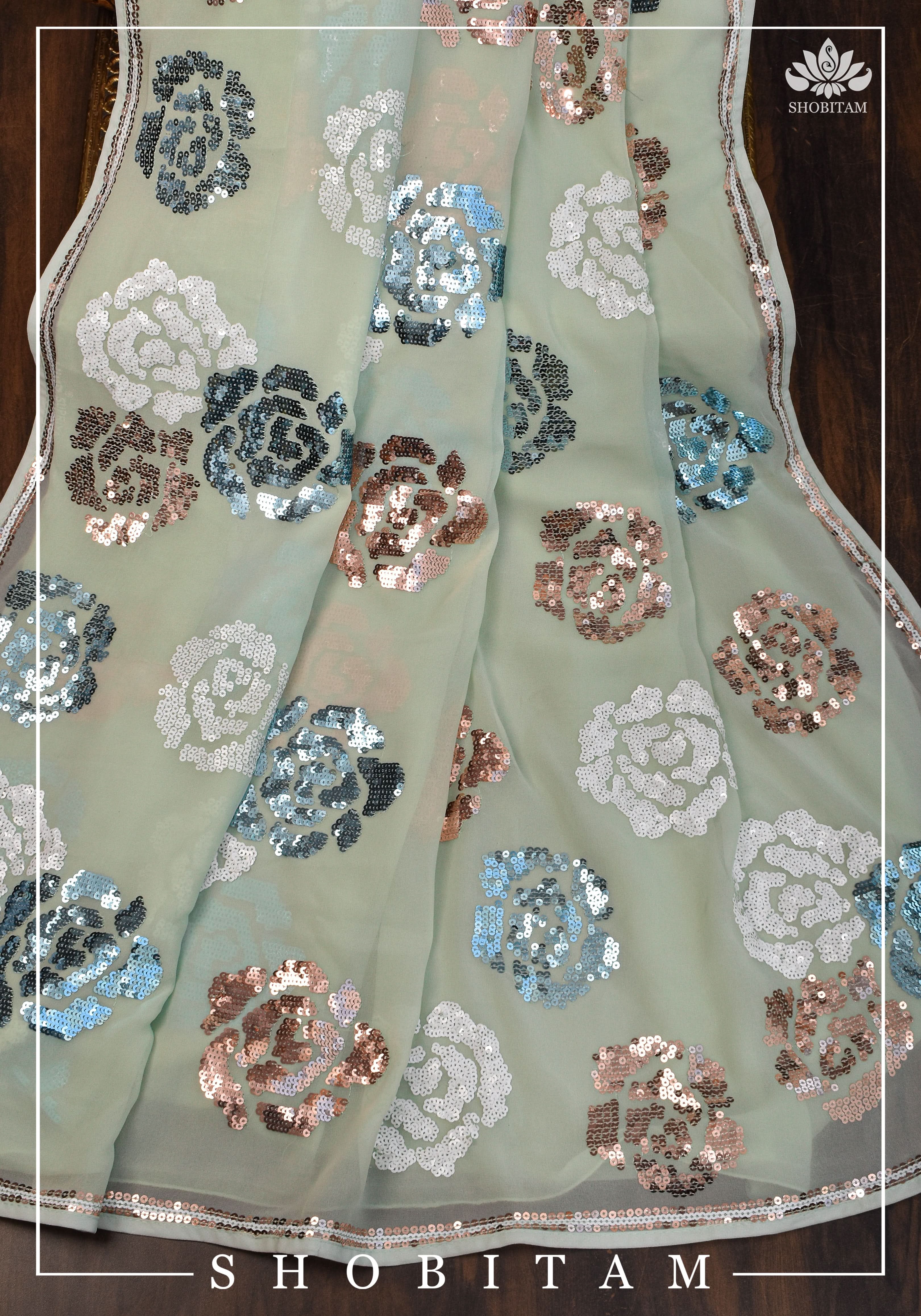 Georgette Saree in pale pista green with rose design sequin work | Shobitam