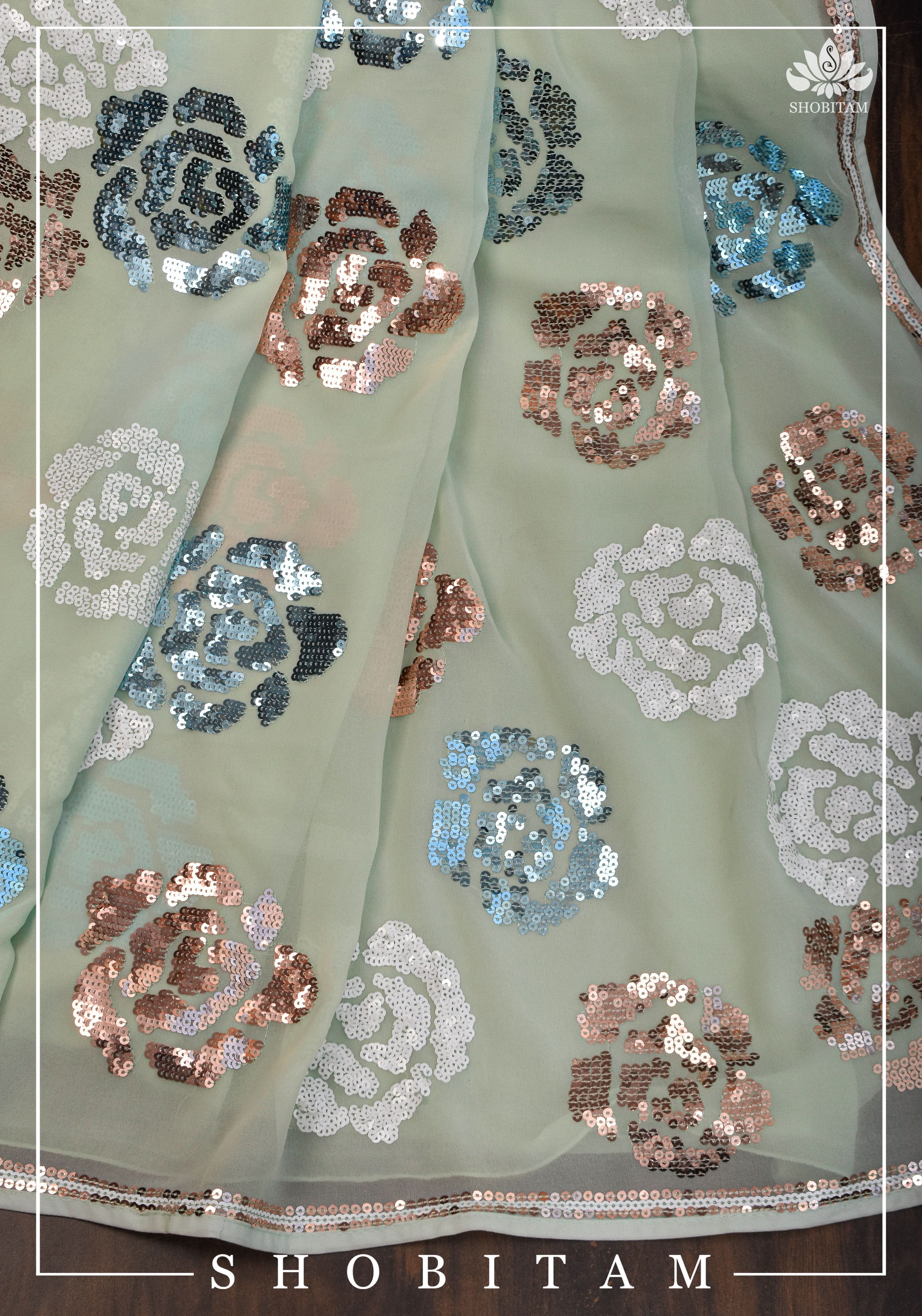 Georgette Saree in pale pista green with rose design sequin work | Shobitam