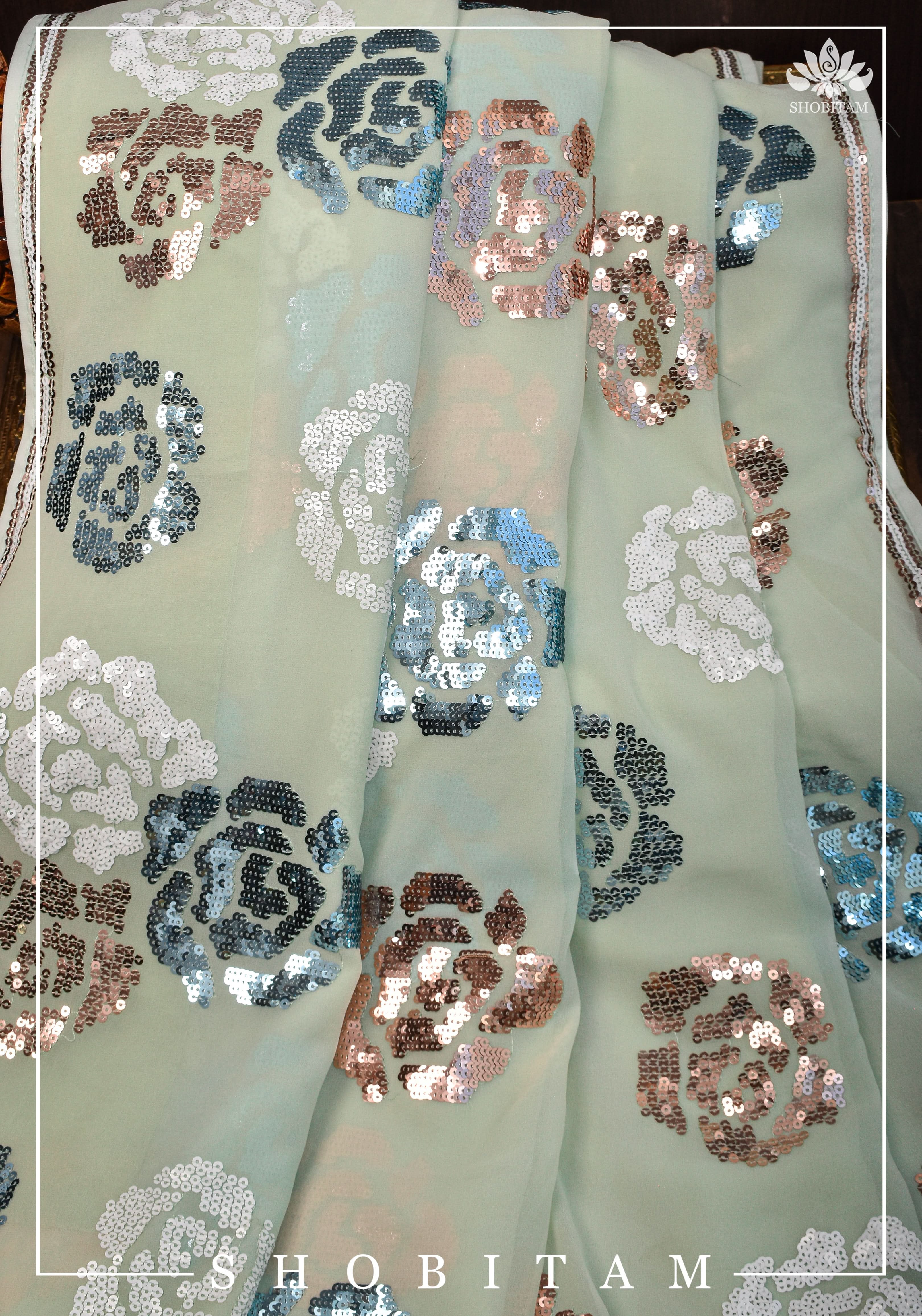Georgette Saree in pale pista green with rose design sequin work | Shobitam