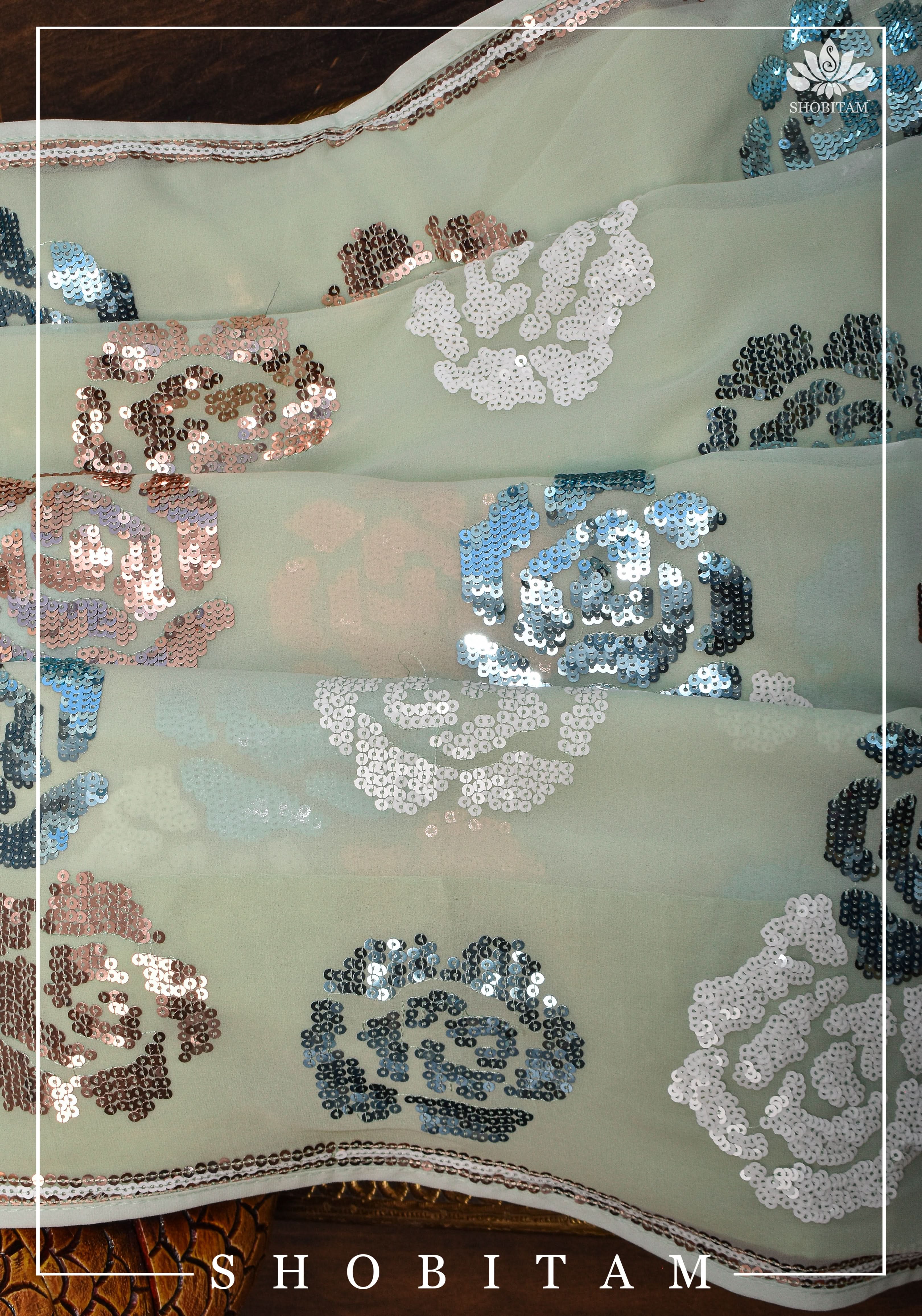 Georgette Saree in pale pista green with rose design sequin work | Shobitam