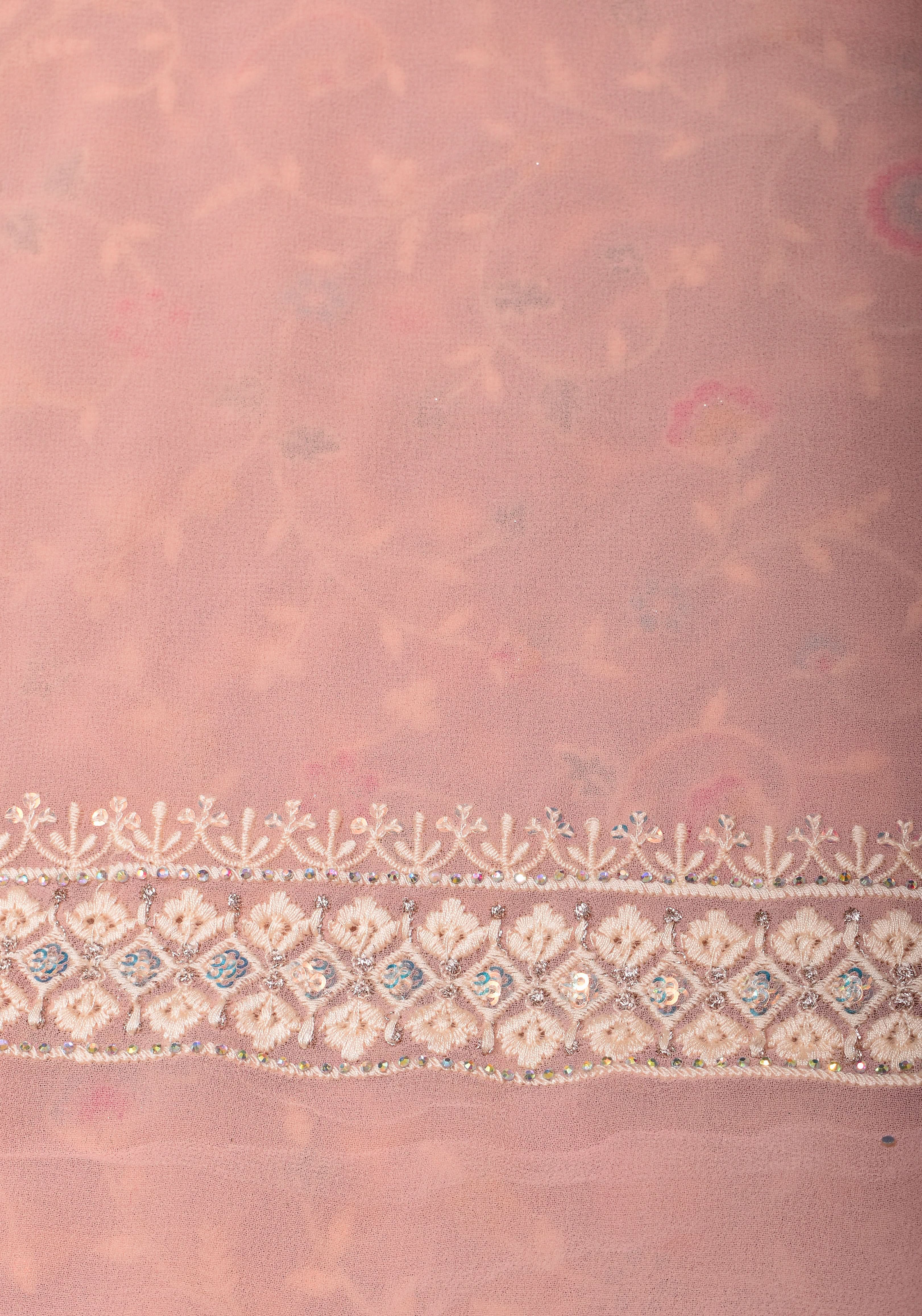 Georgette Saree with Floral Embroidery in Dusty Peach with Dainty Stones Embellishments | Shobitam