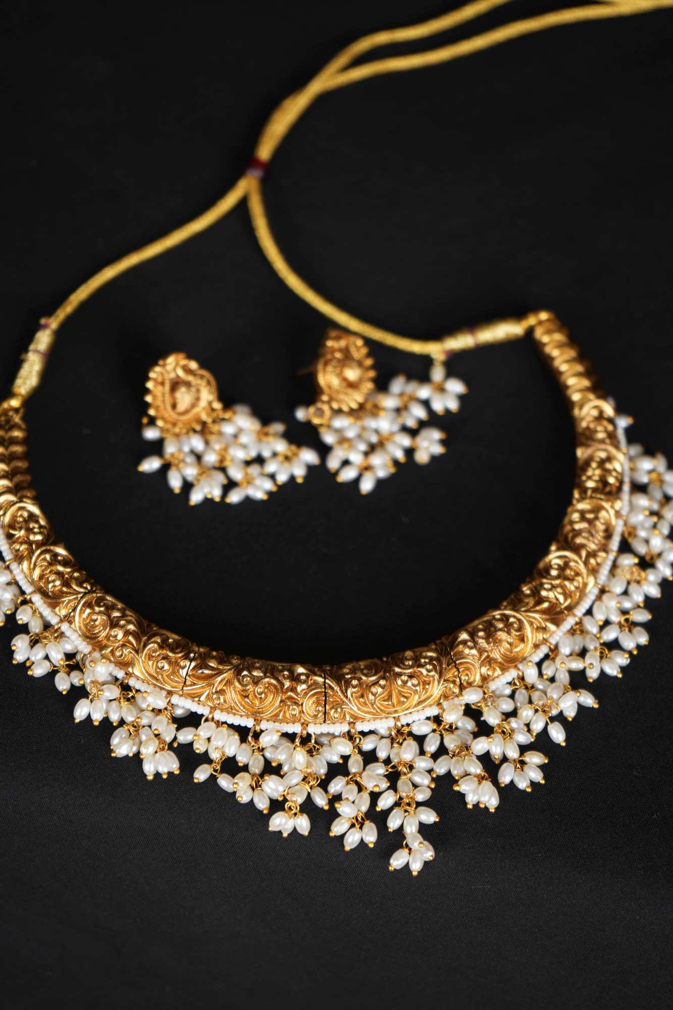 Regal Heritage Gold Necklace Set with Pearl Embellishments & Matching Earrings
