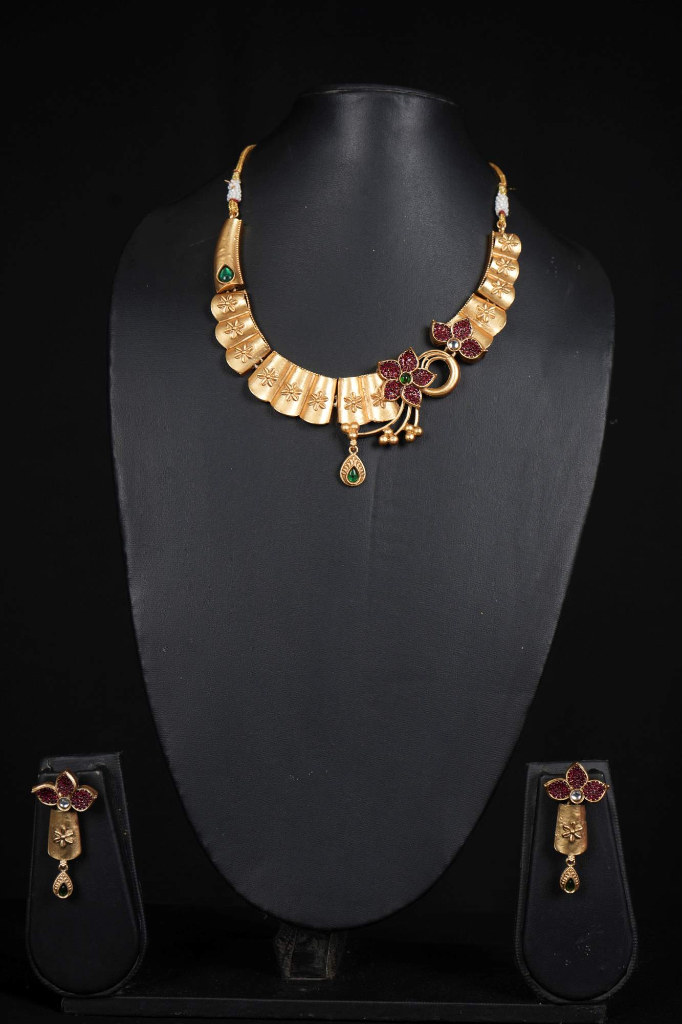 Floral Radiance Matte Gold Necklace Set with Ruby and Emerald Accents