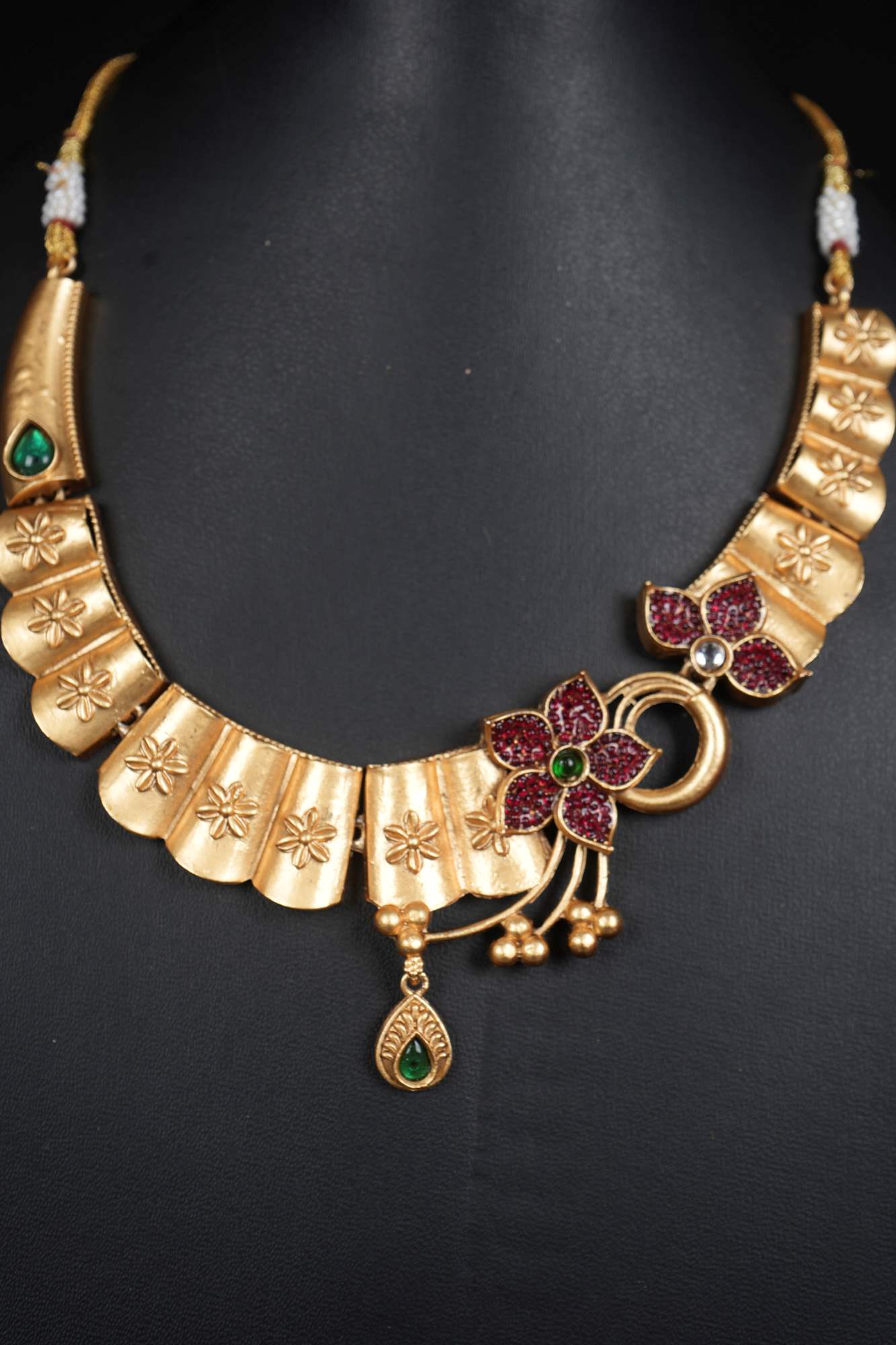 Floral Radiance Matte Gold Necklace Set with Ruby and Emerald Accents