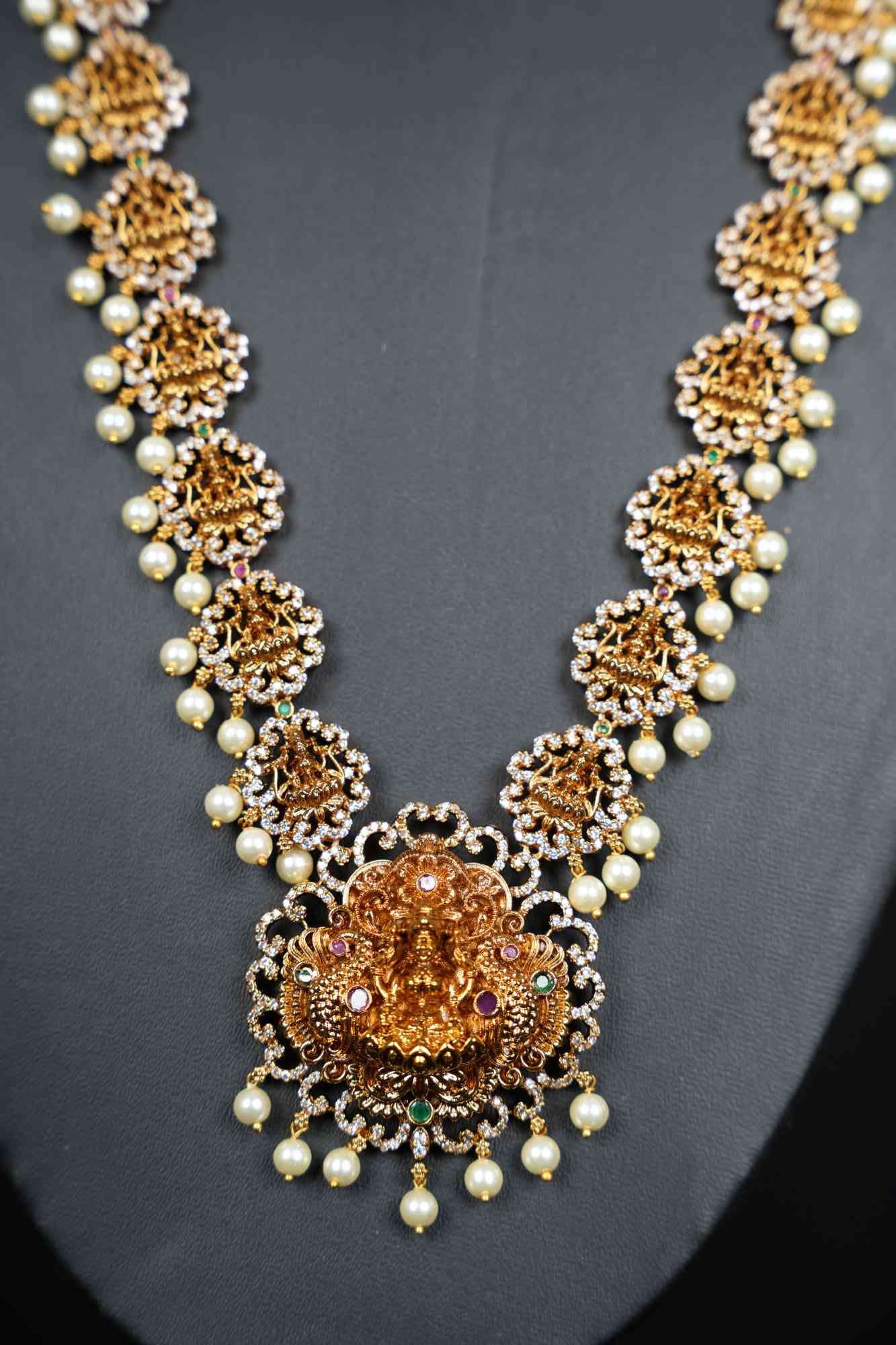 Regal Goddess Temple Jewelry Set with Intricate Gold Detailing and Pearl Accents